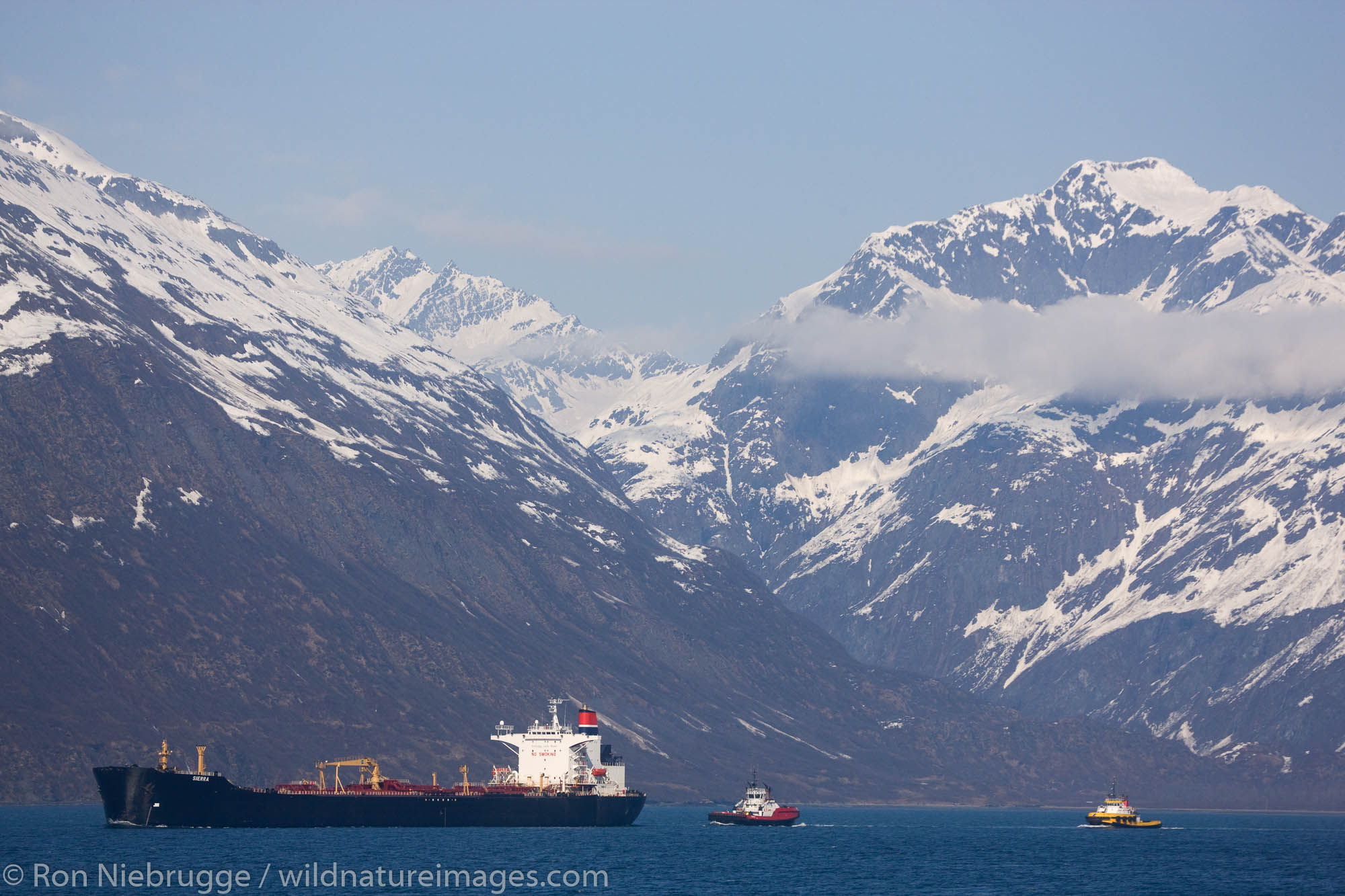 A couple of Crowley tugs escort the oil tanker Sierra, Prince William Sound, Valdez, Alaska