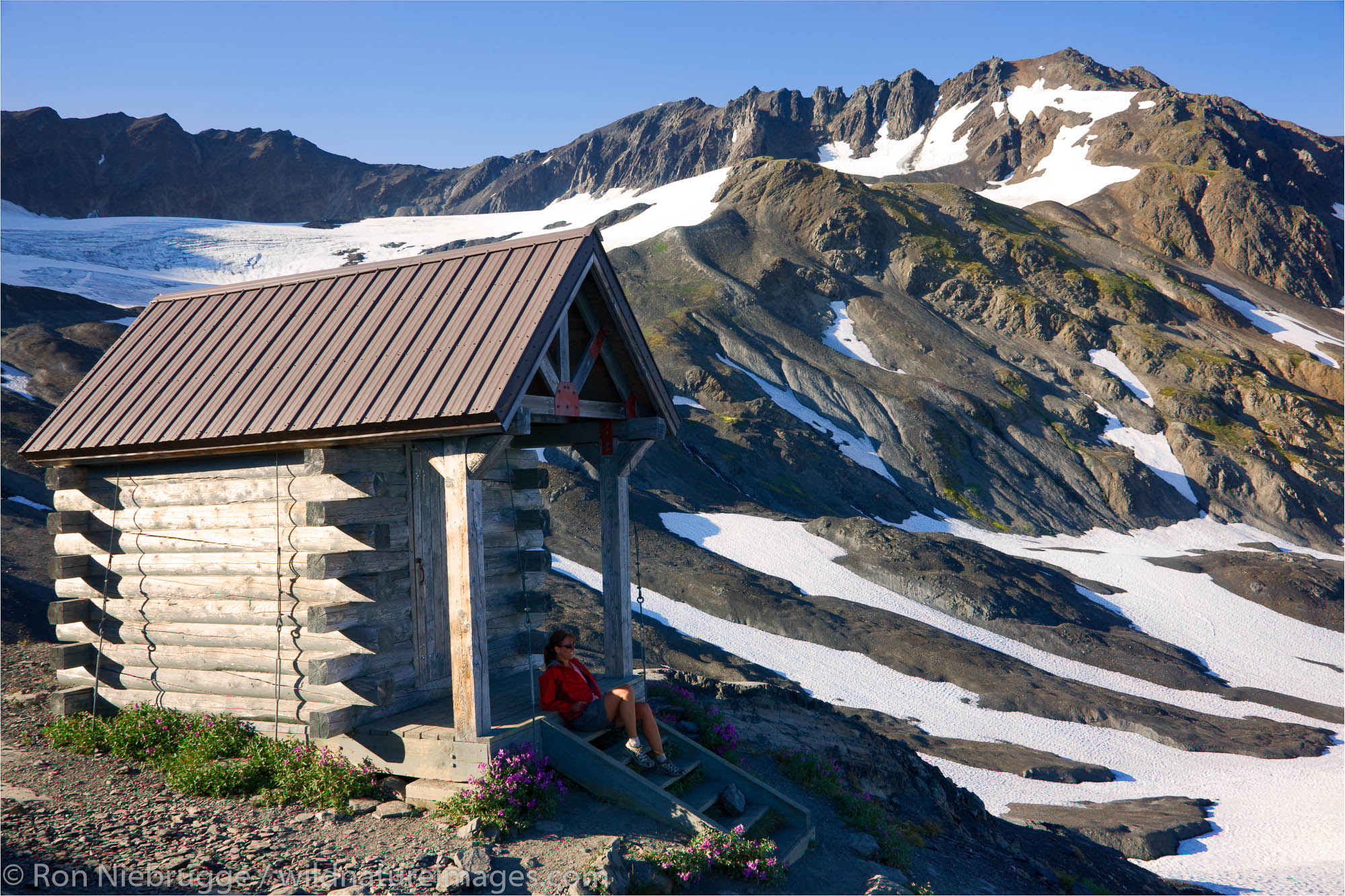 The weather shelter at the end of the Harding Icefield Trail, Kenai Fjords National Park, Alaska.  (model released)