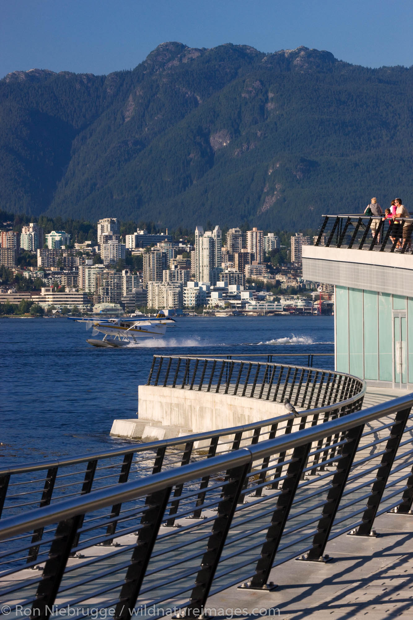 Looking across Coal Harbour towards North Vancouver from the Convention Center, Vancouver, British Columbia, Canada.