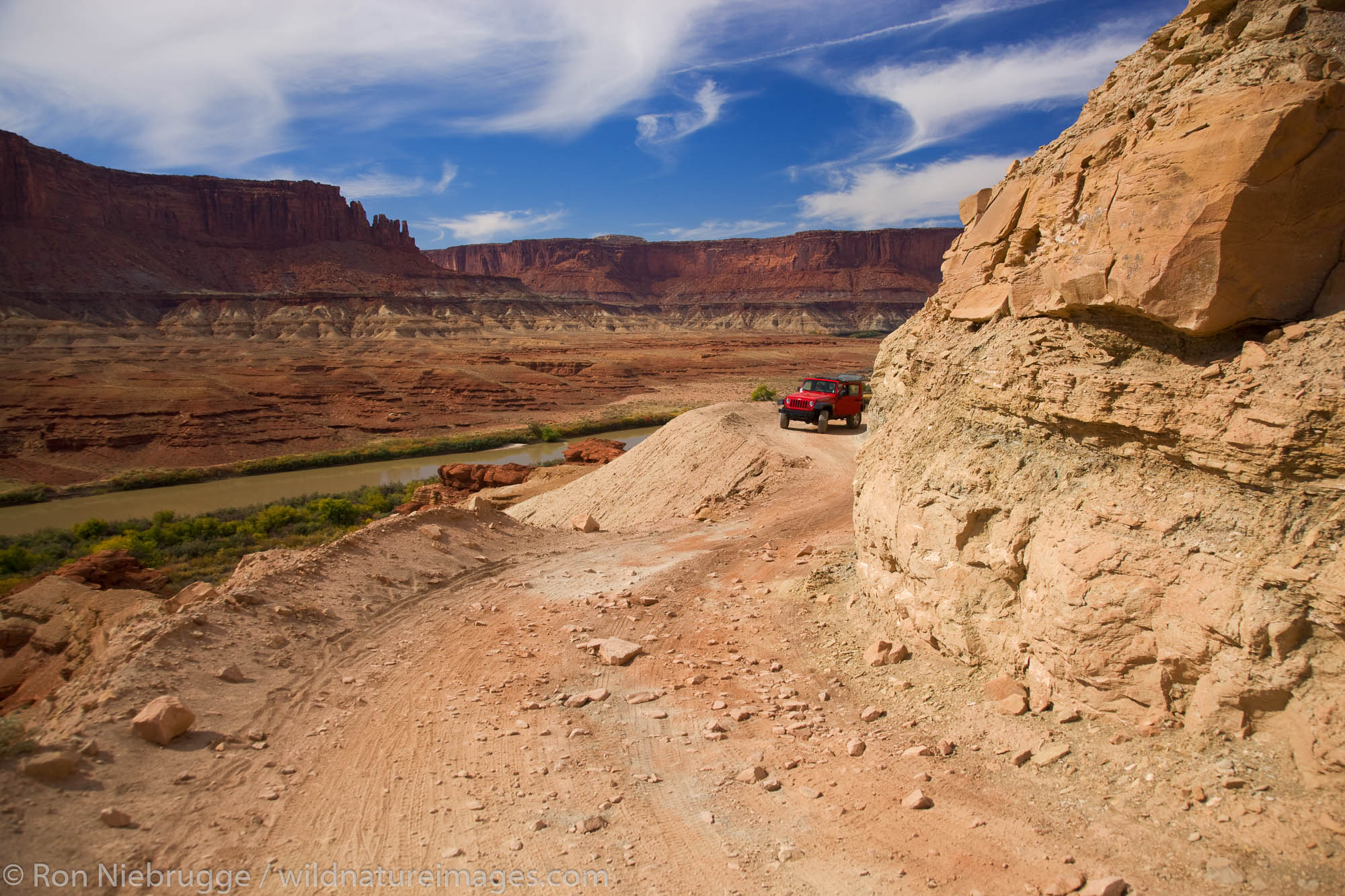 A jeep on Hardscrabble Hill along the White Rim Trail, Island in the Sky District, Canyonlands National Park, near Moab, Utah...