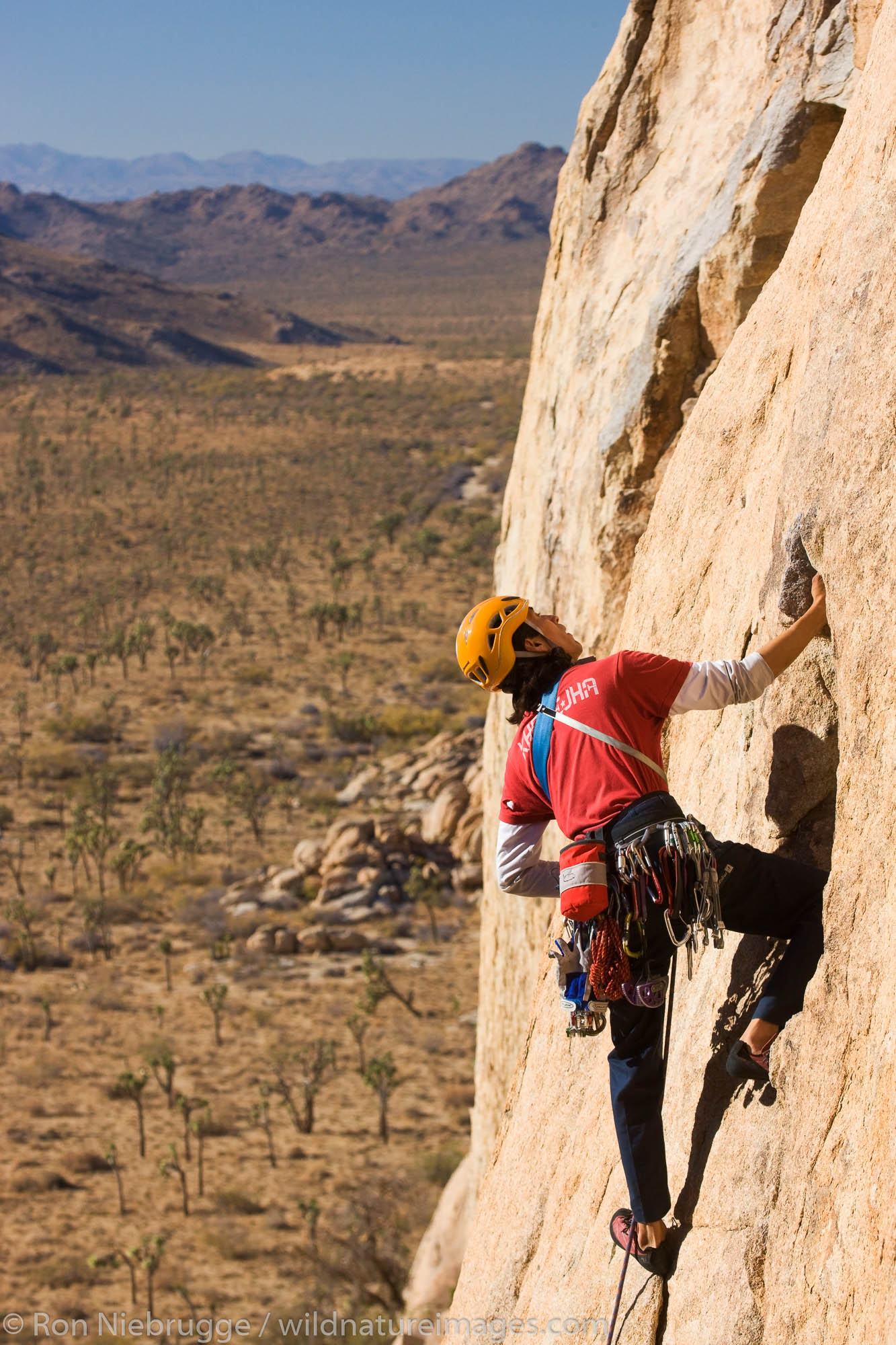 Ernest Sierras rock climbing in Joshua Tree National Park, California.  (model released)