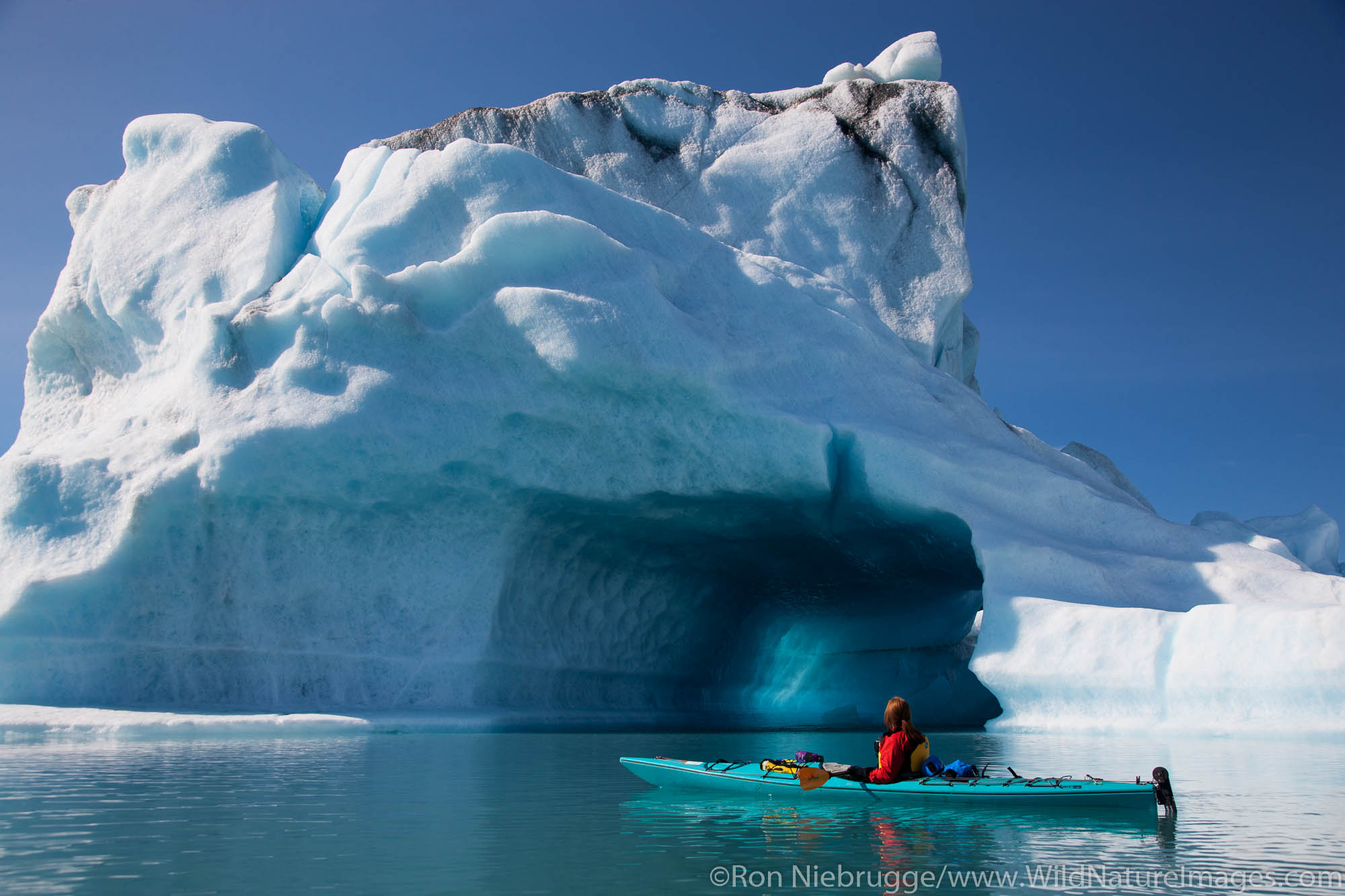 Kayaking in Bear Lagoon, Kenai Fjords National Park, near Seward, Alaska. (model released)