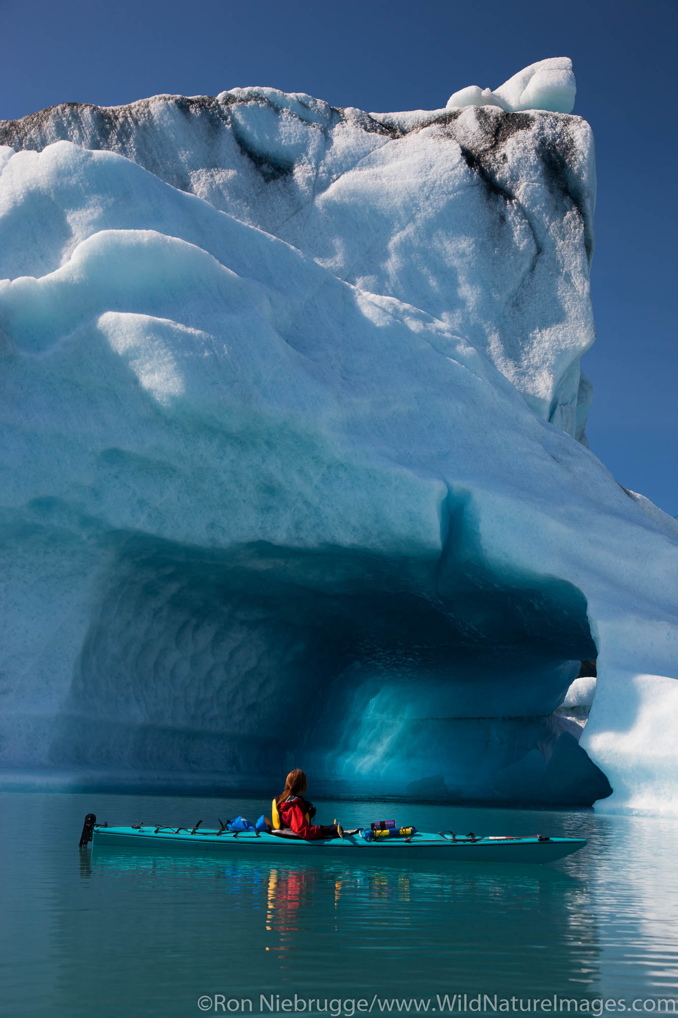 Kayaking in Bear Lagoon, Kenai Fjords National Park, near Seward, Alaska. (model released)