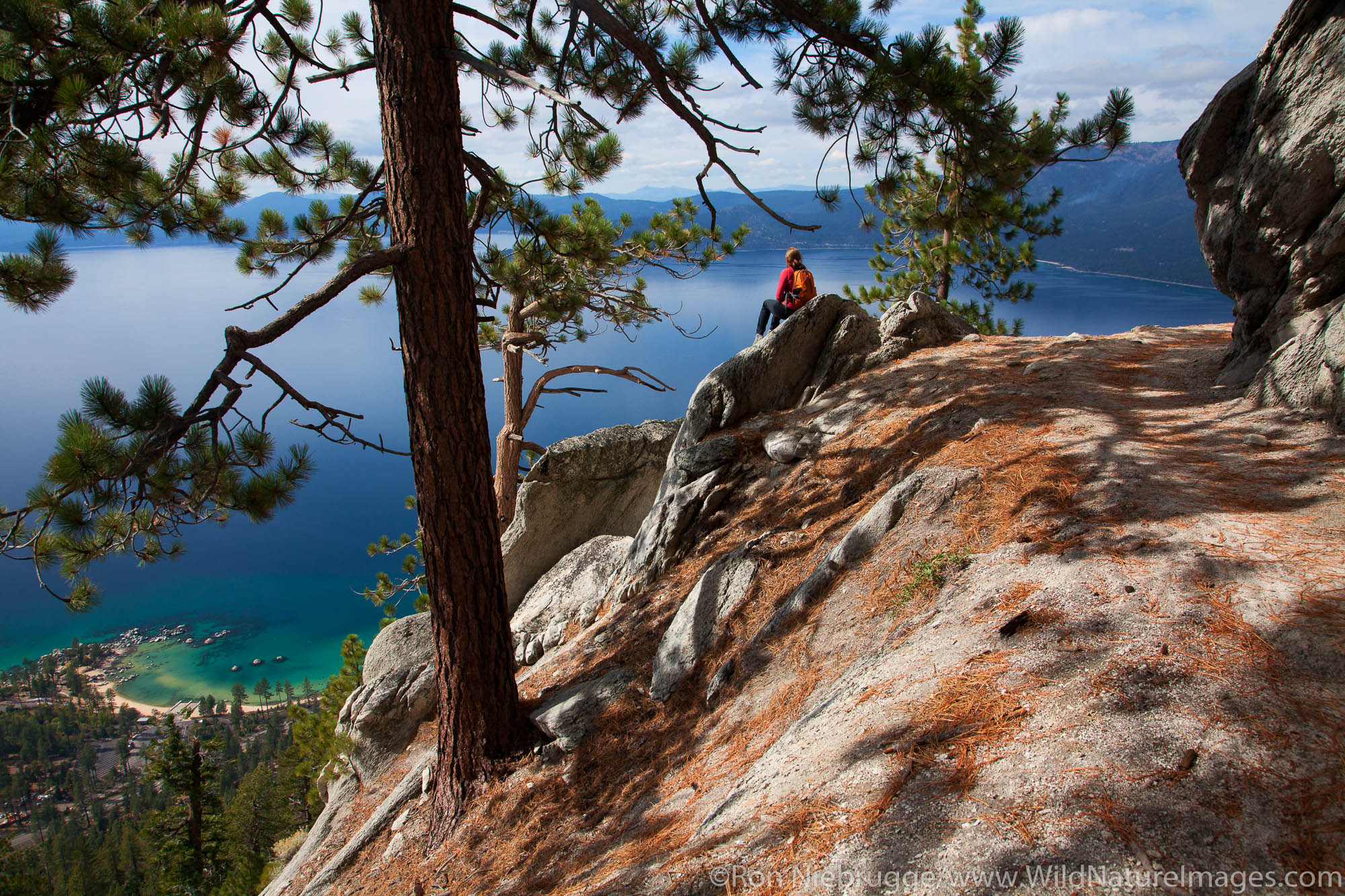 A hiker enjoys the view along the Flume Trail, Lake Tahoe, NV (model released)