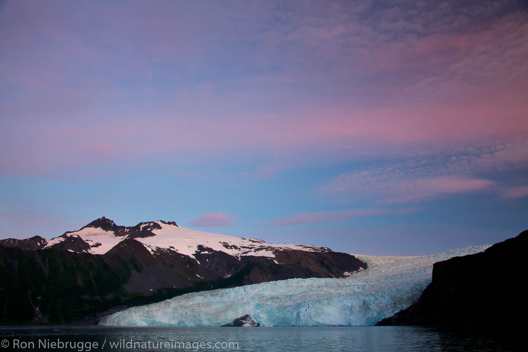 Sunrise on Aialik Glacier and Aialik Bay, Kenai Fjords National Park, near Seward, Alaska.