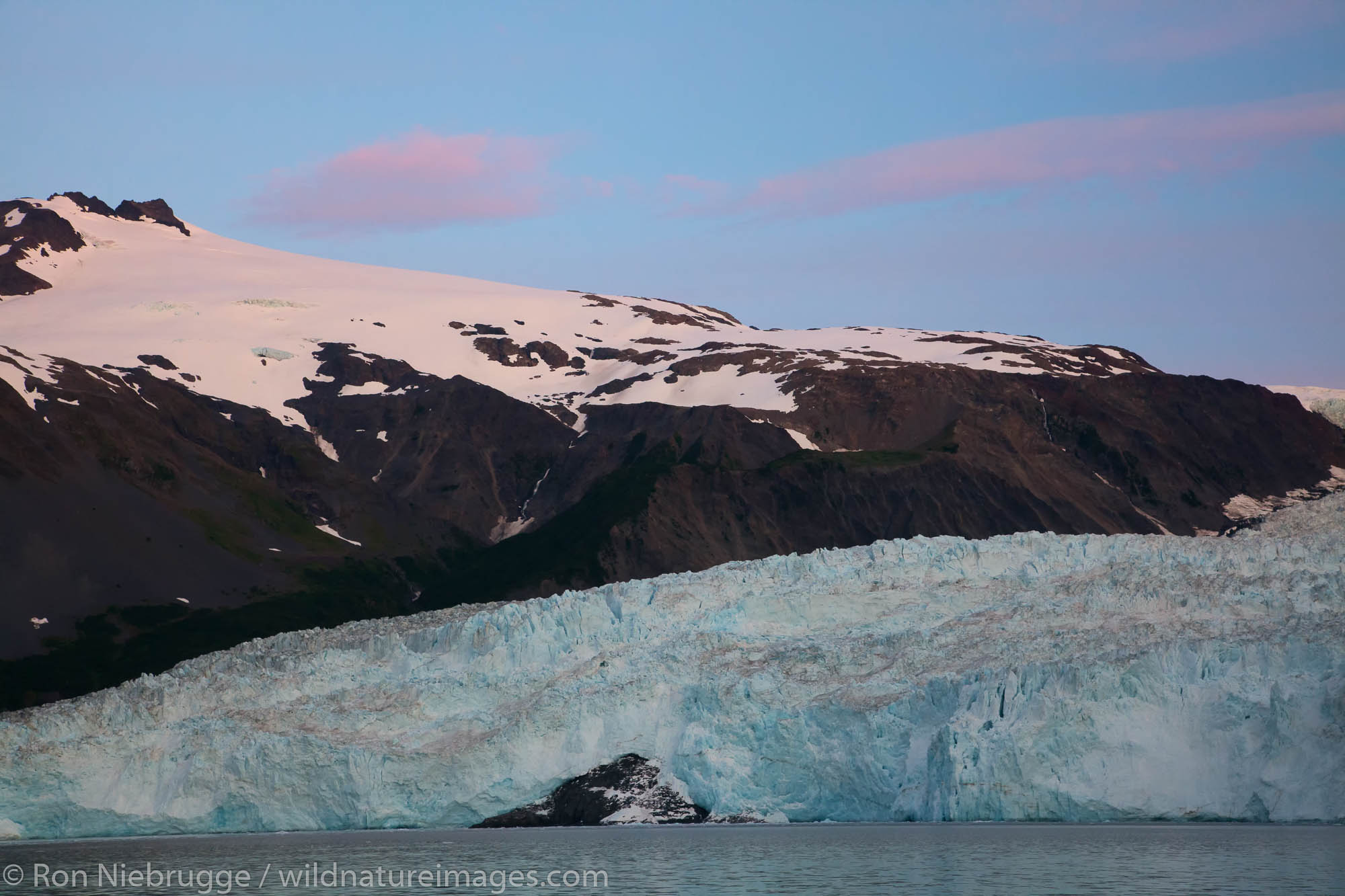 Sunrise on Aialik Glacier and Aialik Bay, Kenai Fjords National Park, near Seward, Alaska.