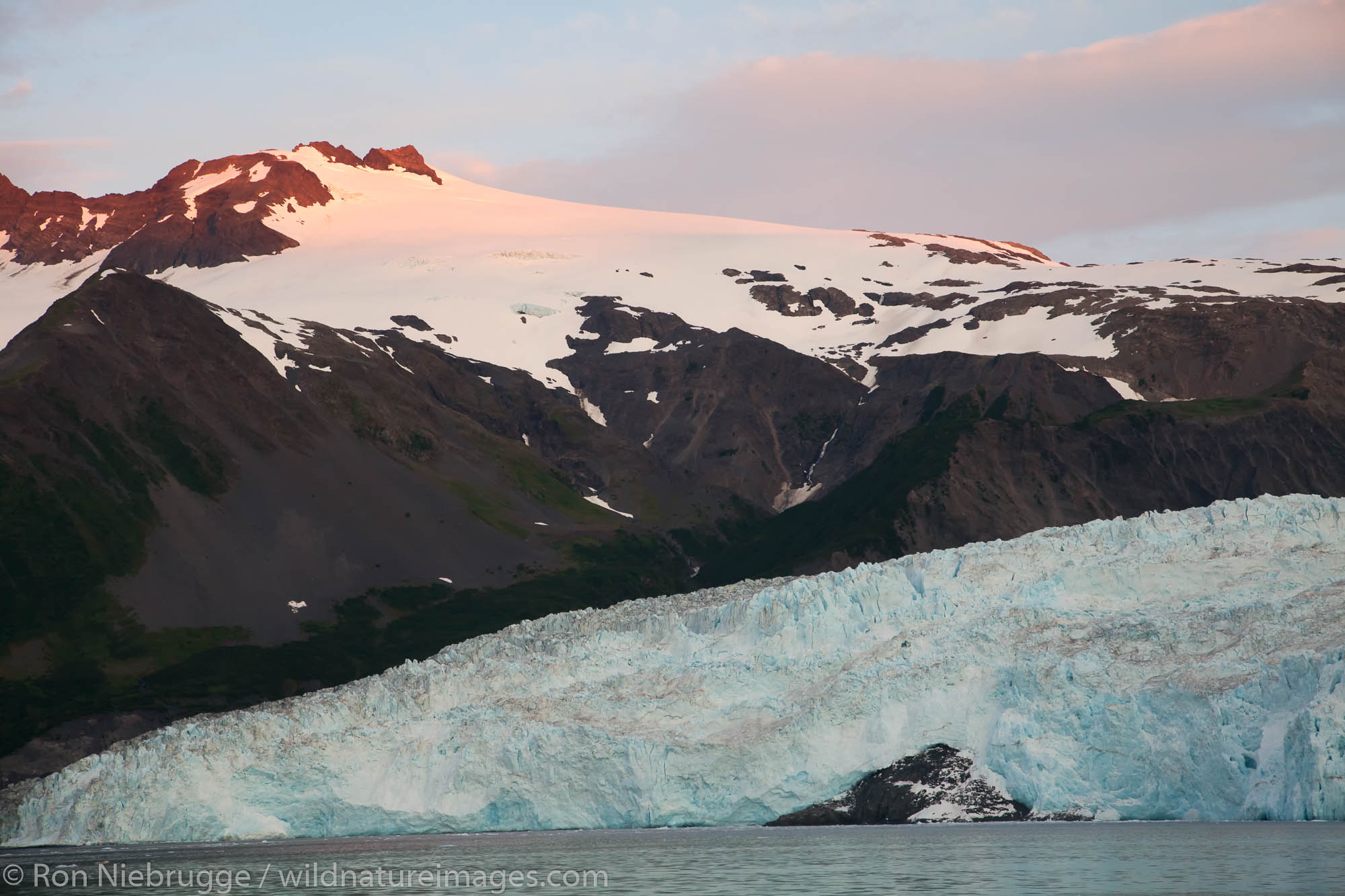 Sunrise on Aialik Glacier and Aialik Bay, Kenai Fjords National Park, near Seward, Alaska.