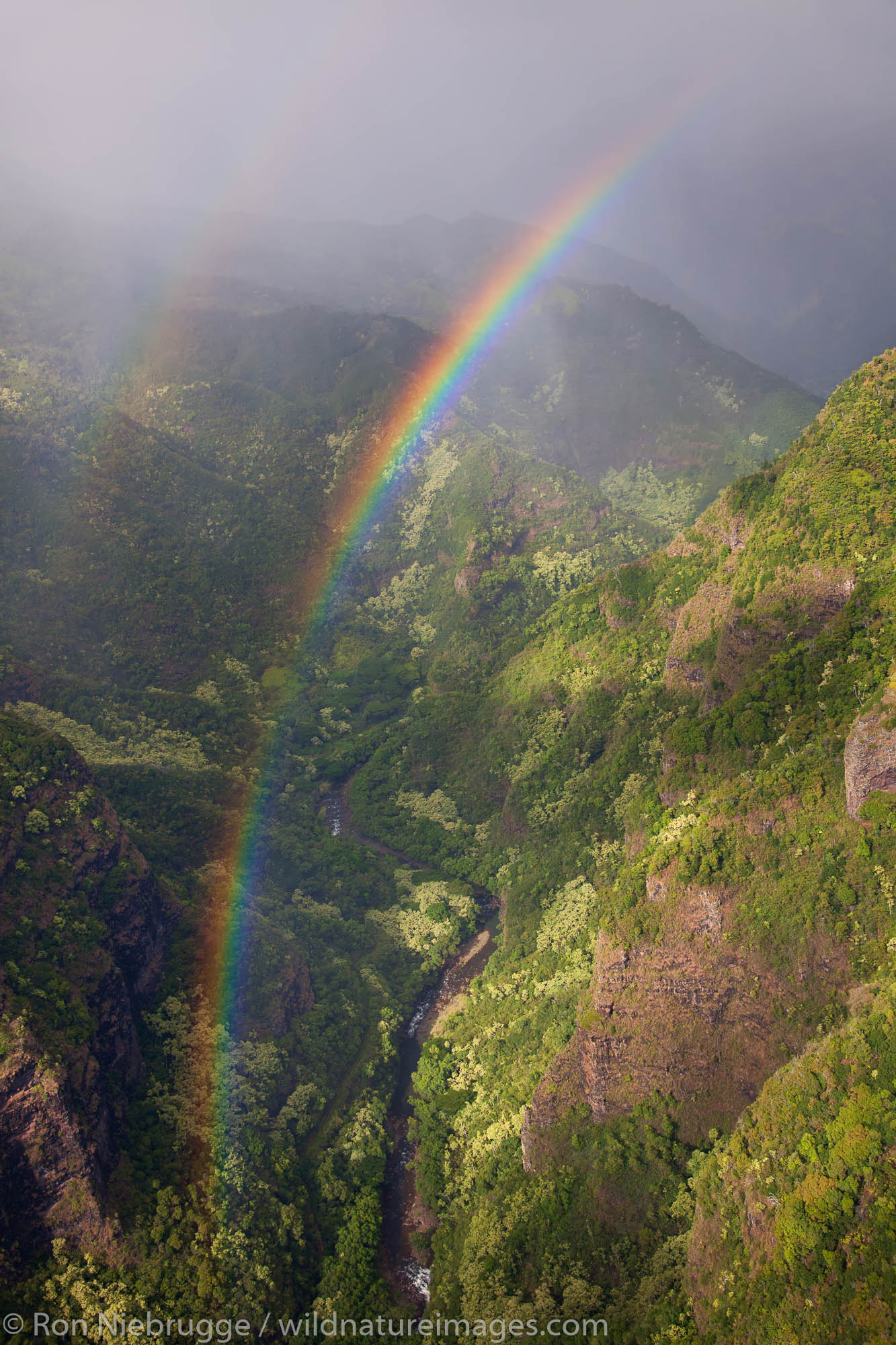 Aerial of rainbow over Kauai, Hawaii.