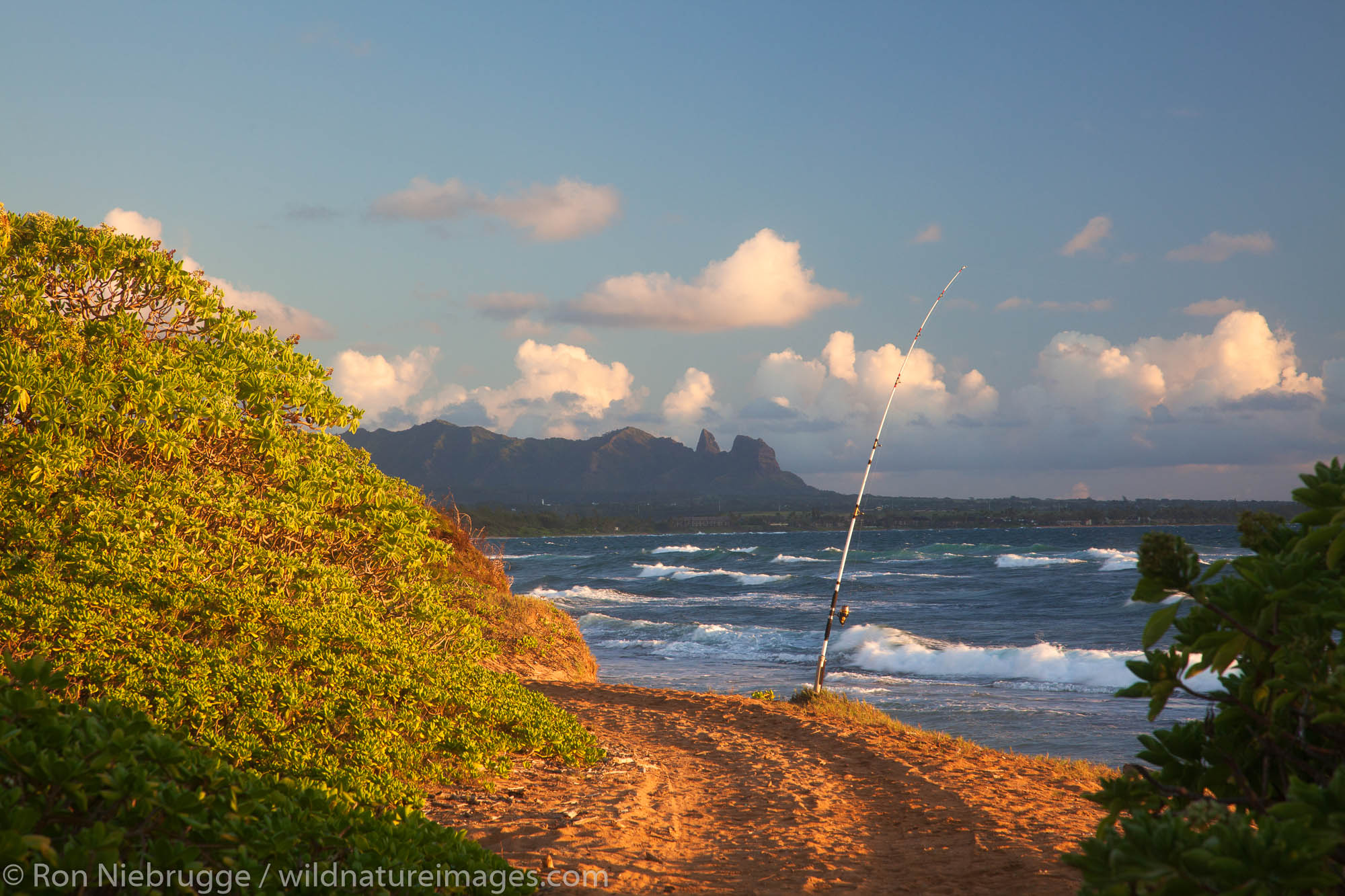 Fishing at Nukoli'i Beach, also known as Kitchens Beach,  Kauai, Hawaii.