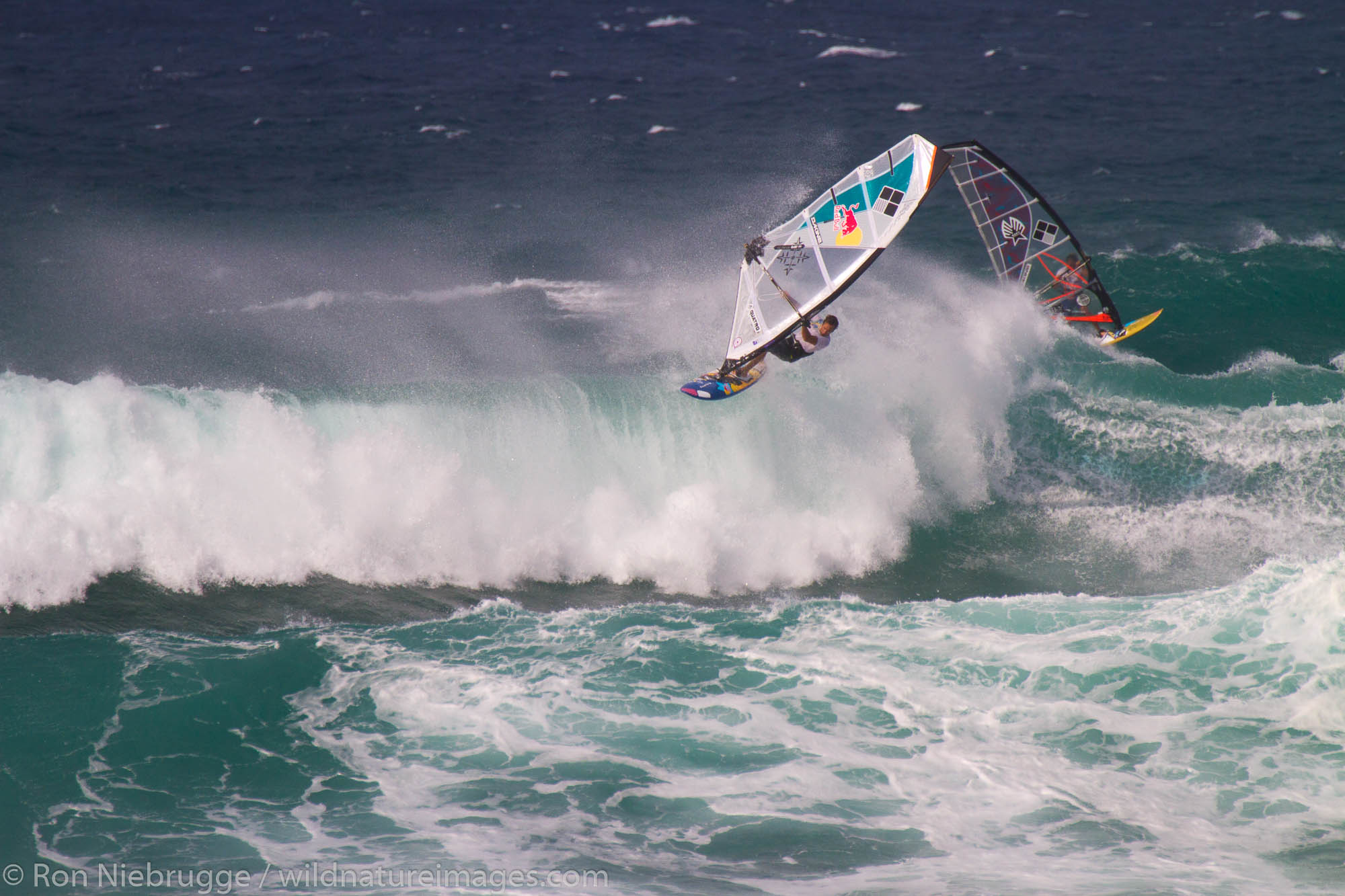 Windsurfers at Ho'okipa Beach, Maui, Hawaii.