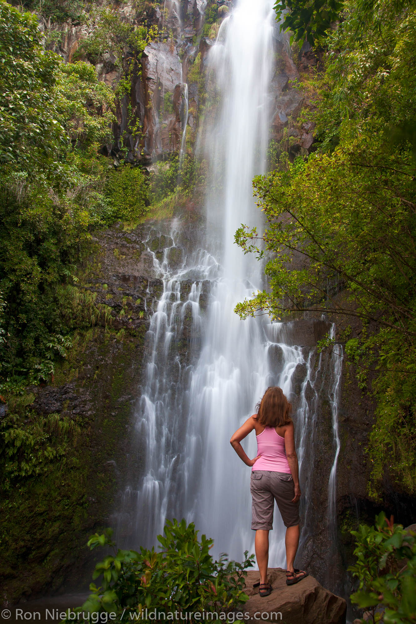 A visitor at Wailua Falls, near Hana, Maui, Hawaii.  (model released)