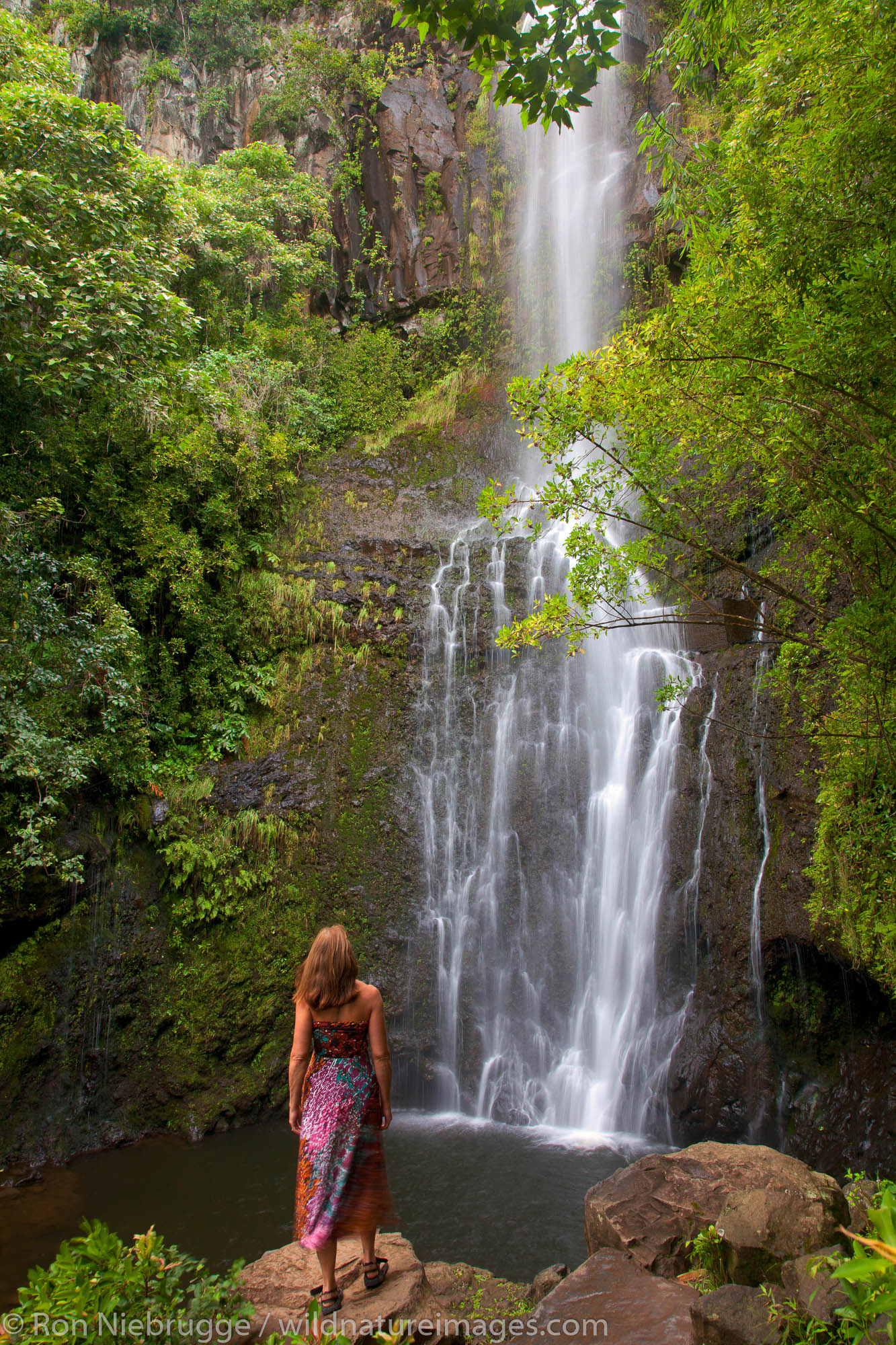 A visitor at Wailua Falls, near Hana, Maui, Hawaii.  (model released)
