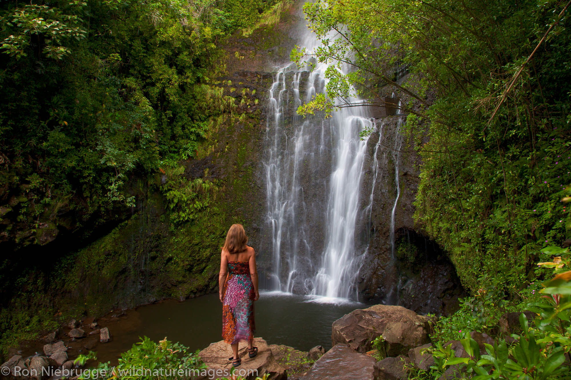 A visitor at Wailua Falls, near Hana, Maui, Hawaii.  (model released)