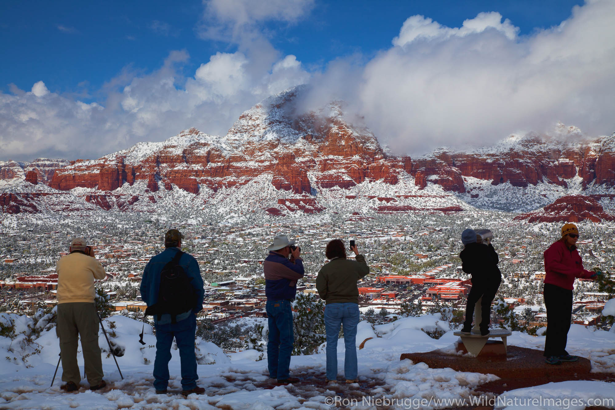 Visitors enjoy winter snow, Sedona, Arizona.