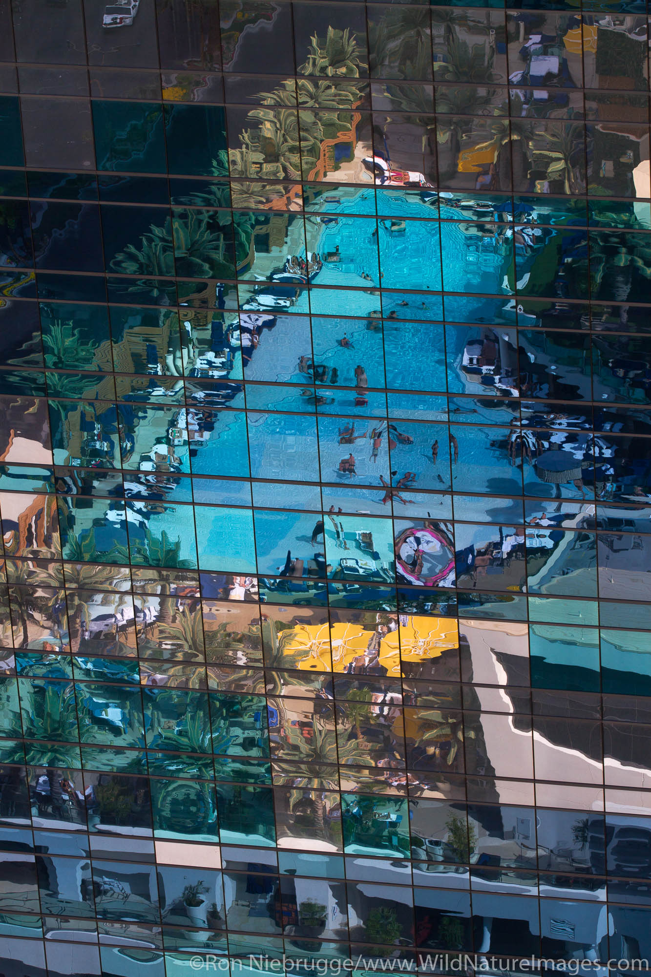 The pool of The Cosmopolitan Hotel and Casino reflect in a nearby building in City Center, Las Vegas, Nevada.
