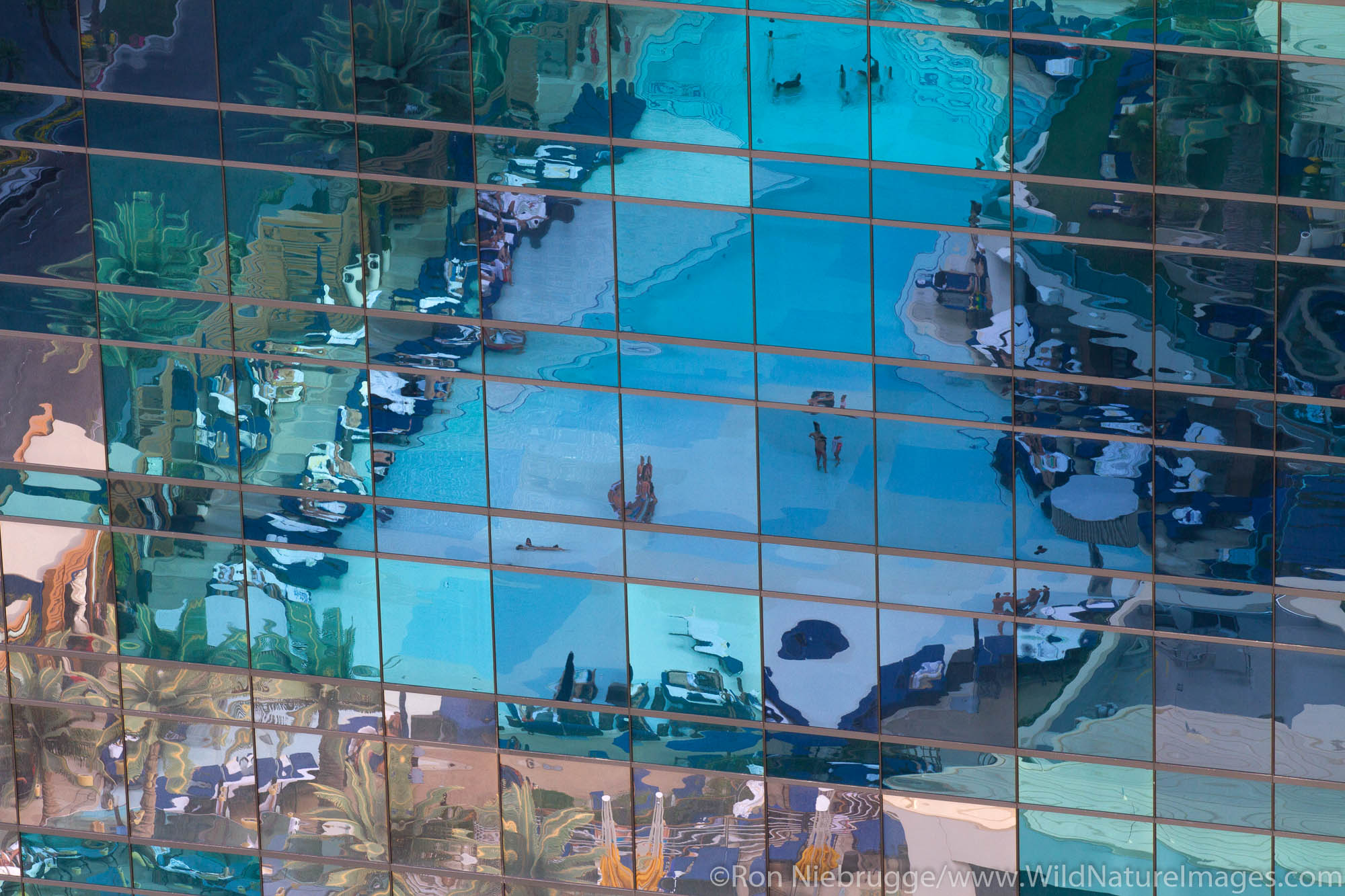 The pool of The Cosmopolitan Hotel and Casino reflect in a nearby building in City Center, Las Vegas, Nevada.
