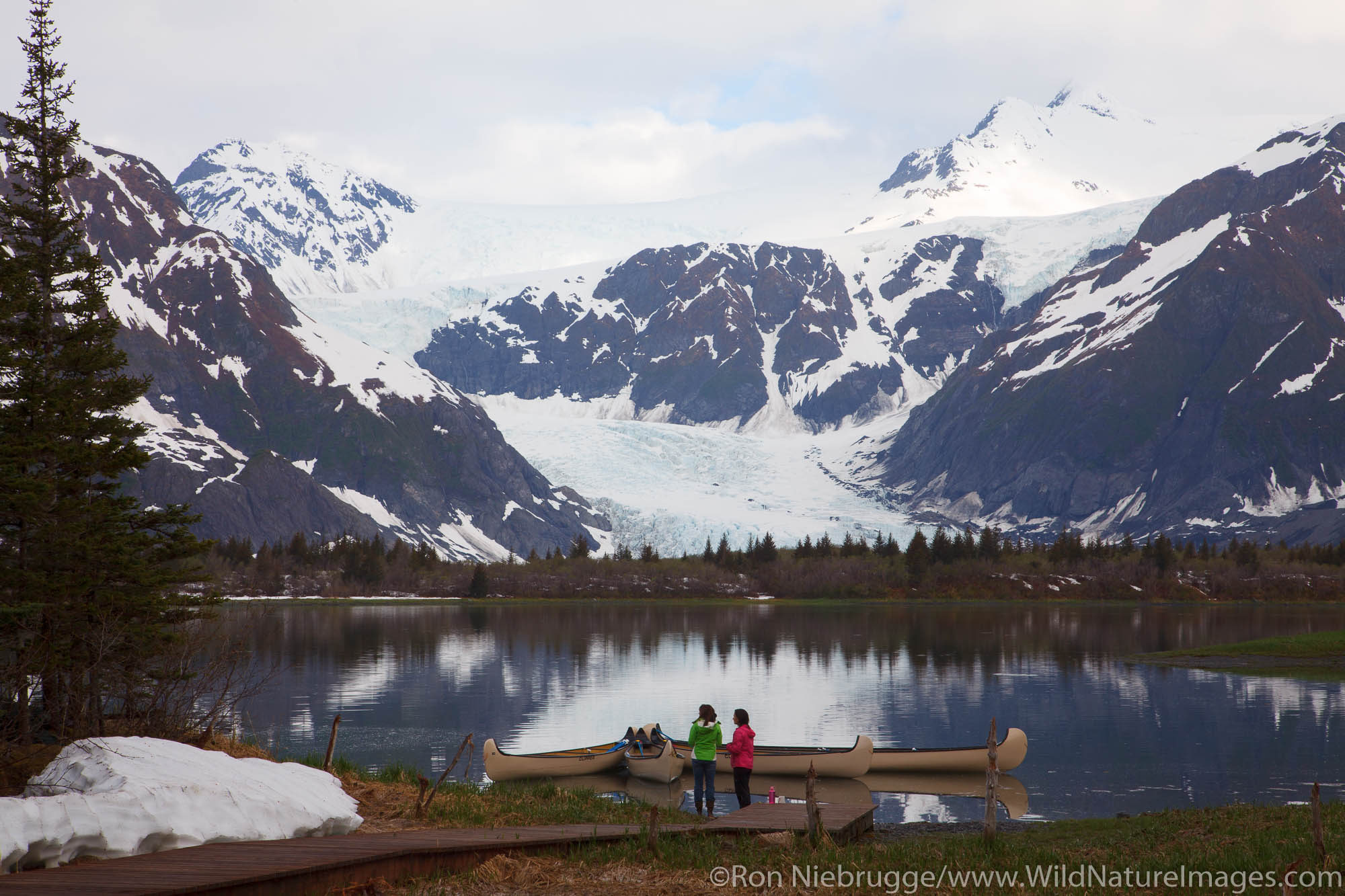 Visitors viewing Pedersen Lagoon from the Kenai Fjords Glacier Lodge, Kenai Fjords National Park, near Seward, Alaska.
