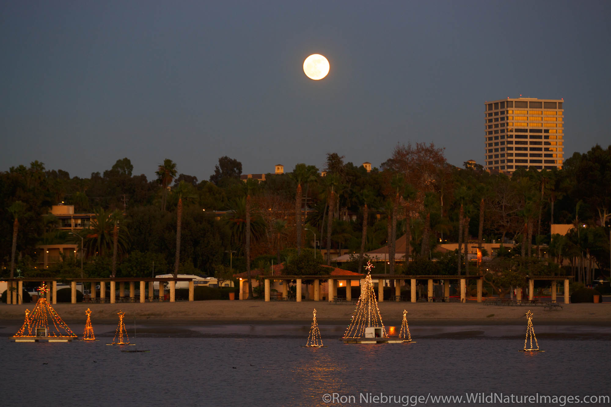 Full moon over Fashion Island from the Back Bay, Newport Beach, Orange County, California.