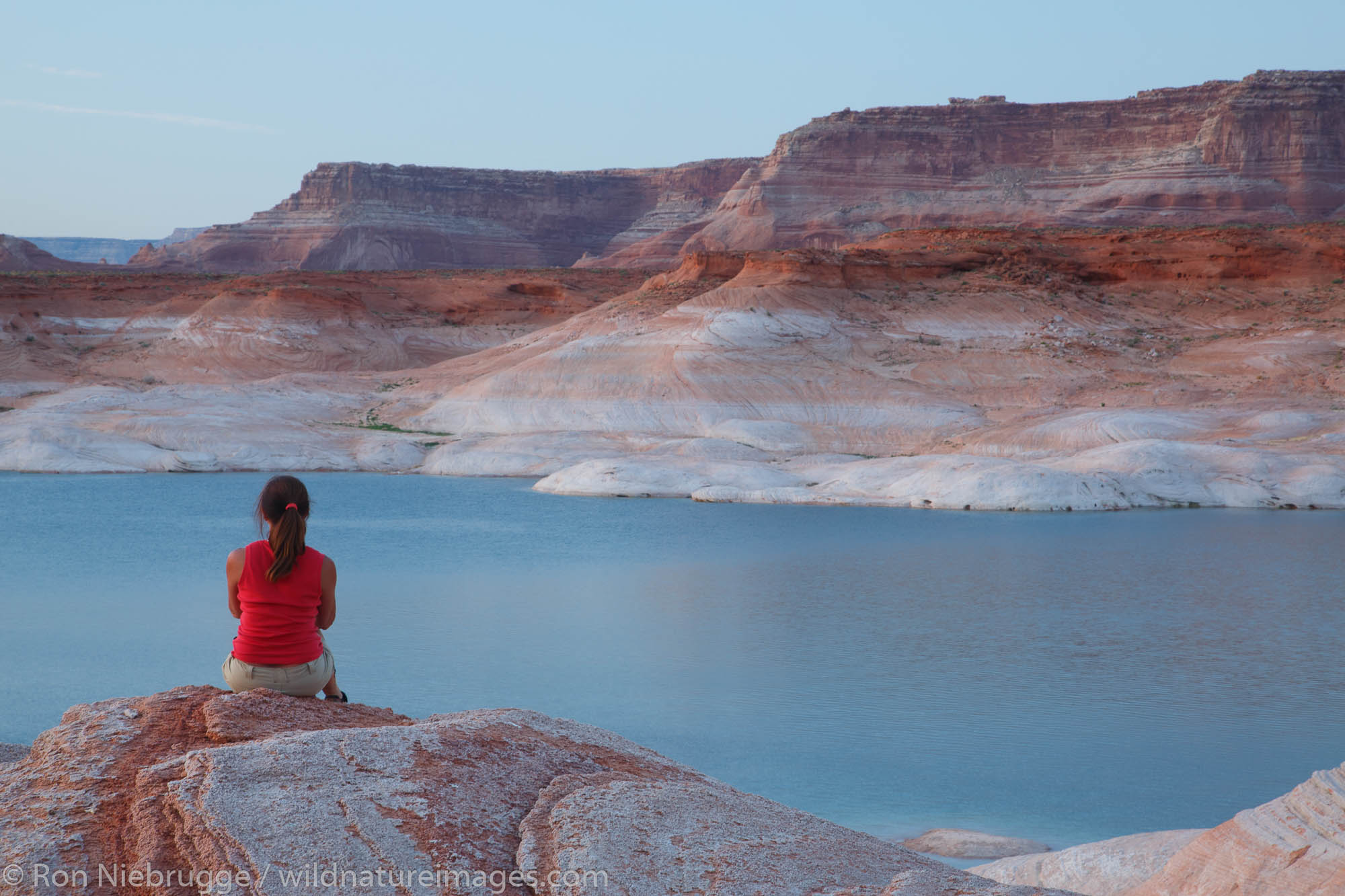 A visitor at West Canyon Lake Powell Glen Canyon National Recreation Area Page Arizona. (model released)