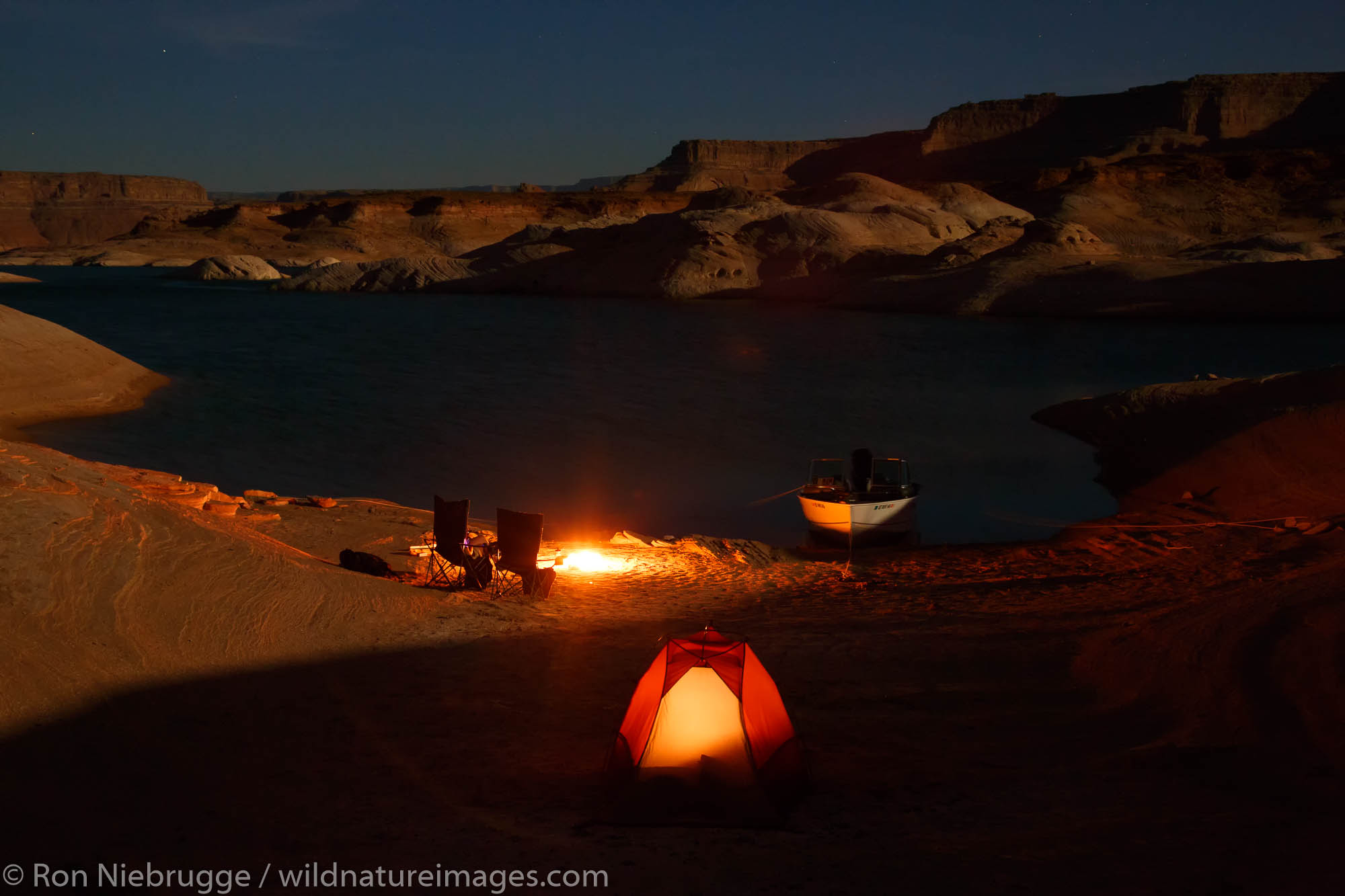 Boat camping in West Canyon, Lake Powell, Glen Canyon National Recreation Area, Page, Arizona.