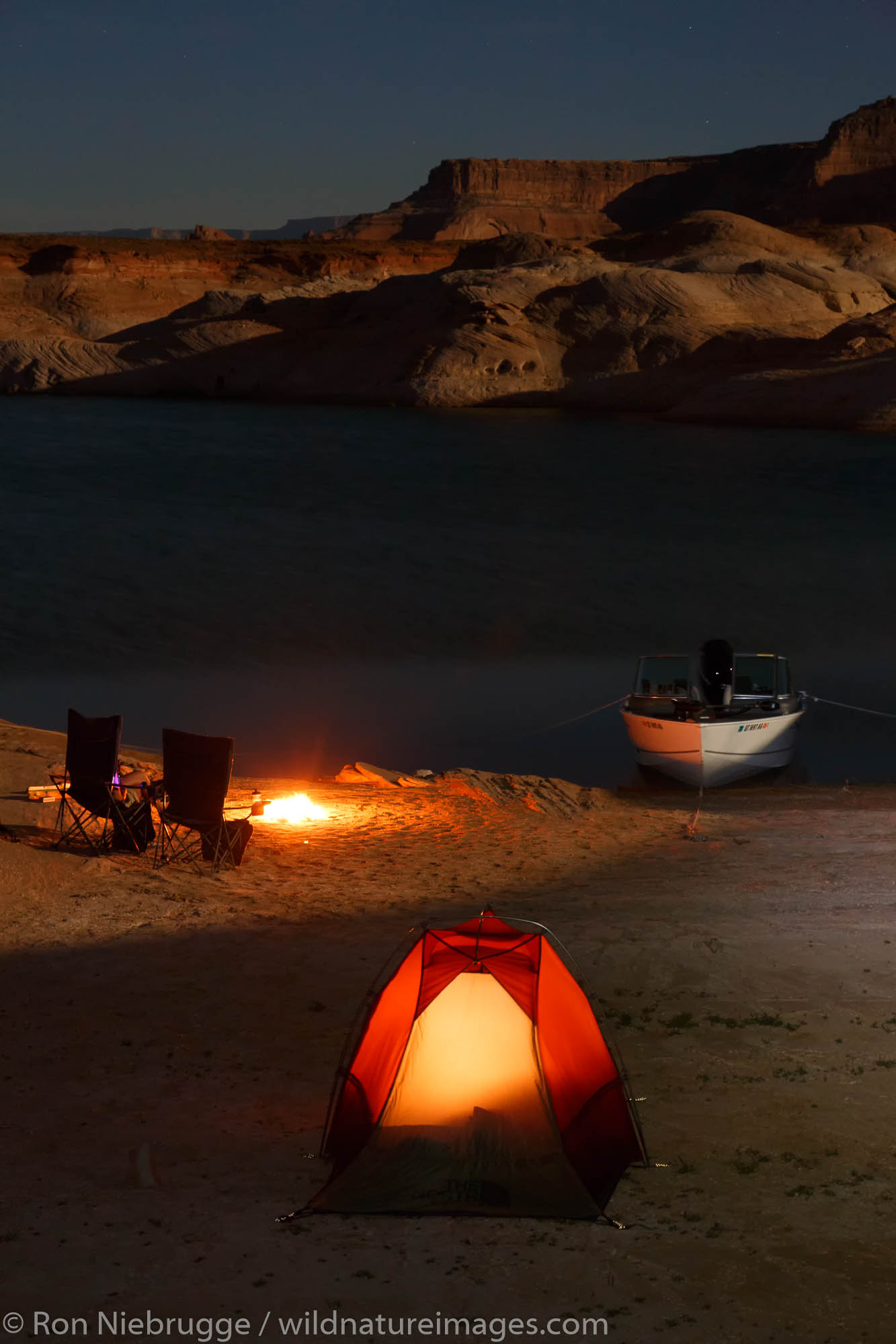 Boat camping in West Canyon, Lake Powell, Glen Canyon National Recreation Area, Page, Arizona.