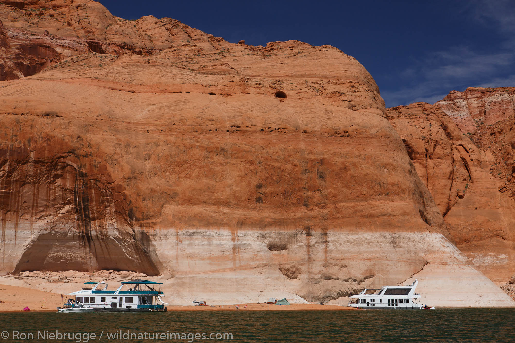 Houseboats in Navajo Canyon, Lake Powell, Glen Canyon National Recreation Area, Page, Arizona.