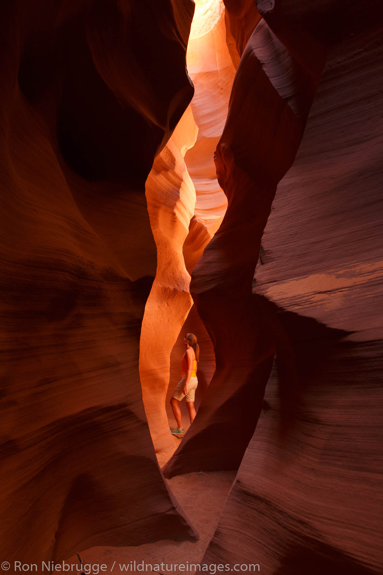 A visitor in the slot canyon known as Secret Canyon on Navajo land, Page, Arizona.  (model released)