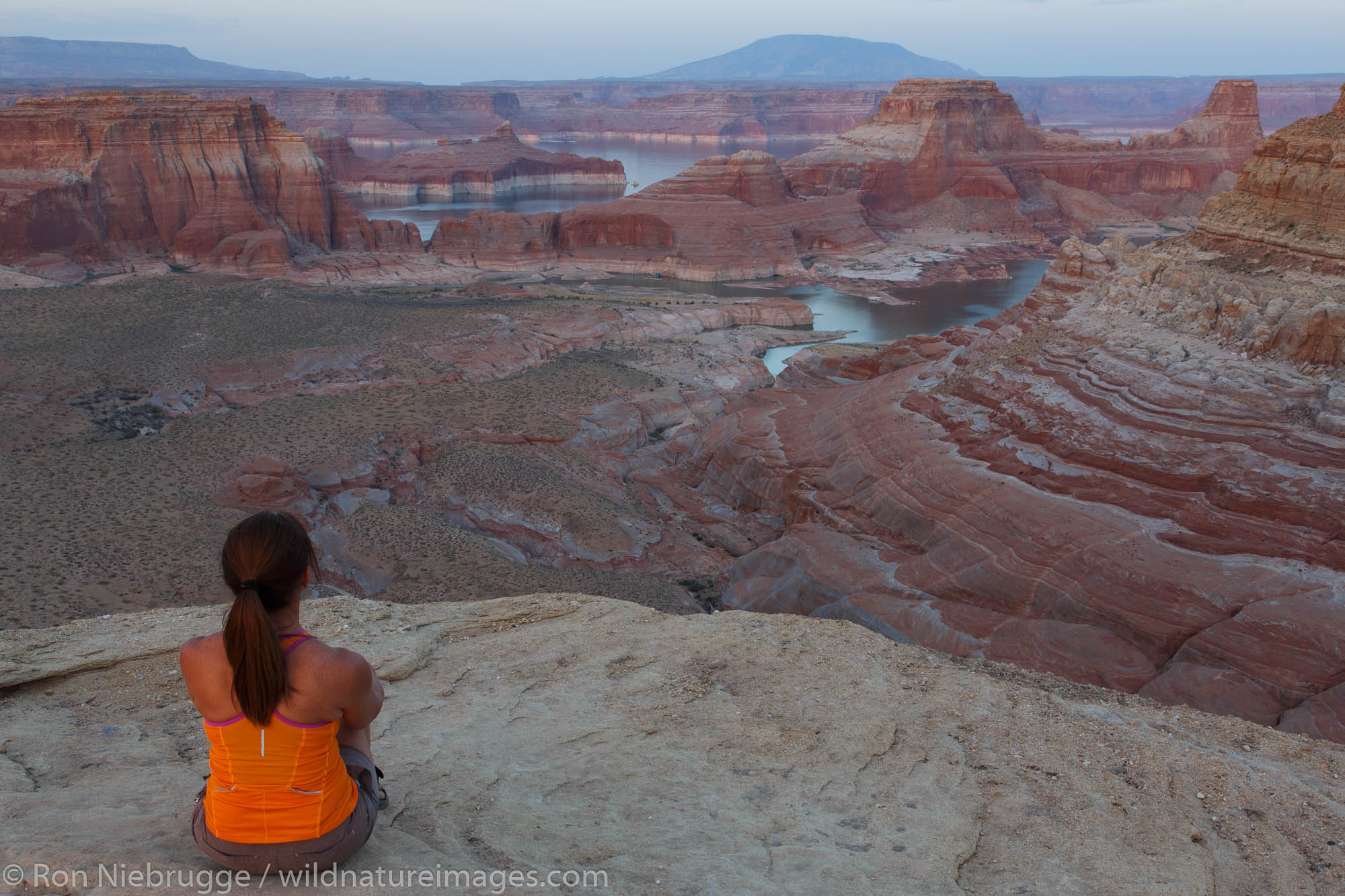 A visitor at Alstrom Point, Lake Powell, Glen Canyon National Recreation Area, Page, Arizona.  (model released)