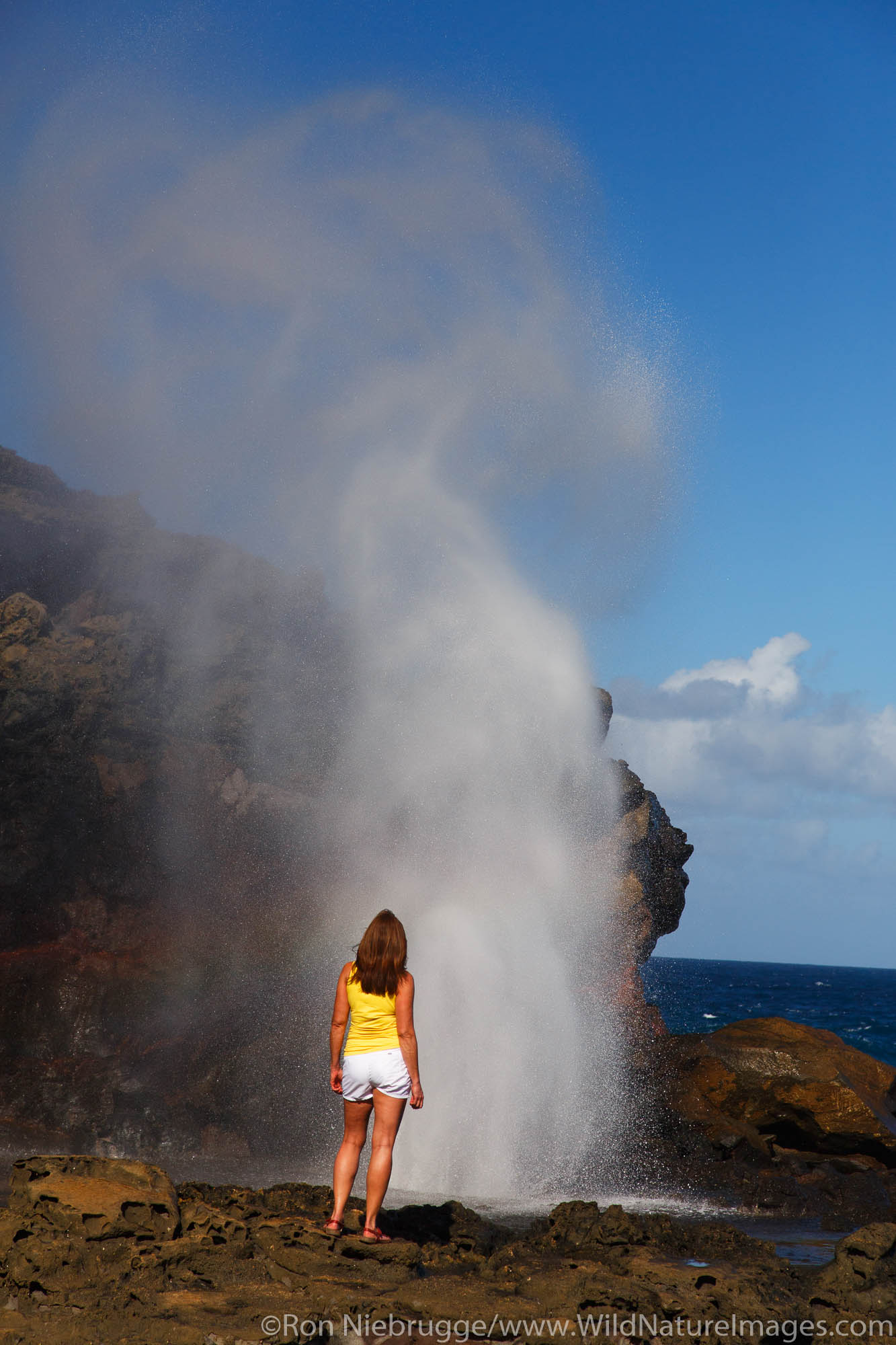 Visitor at the Nakalele Blowhole, Maui, Hawaii.  (model released)