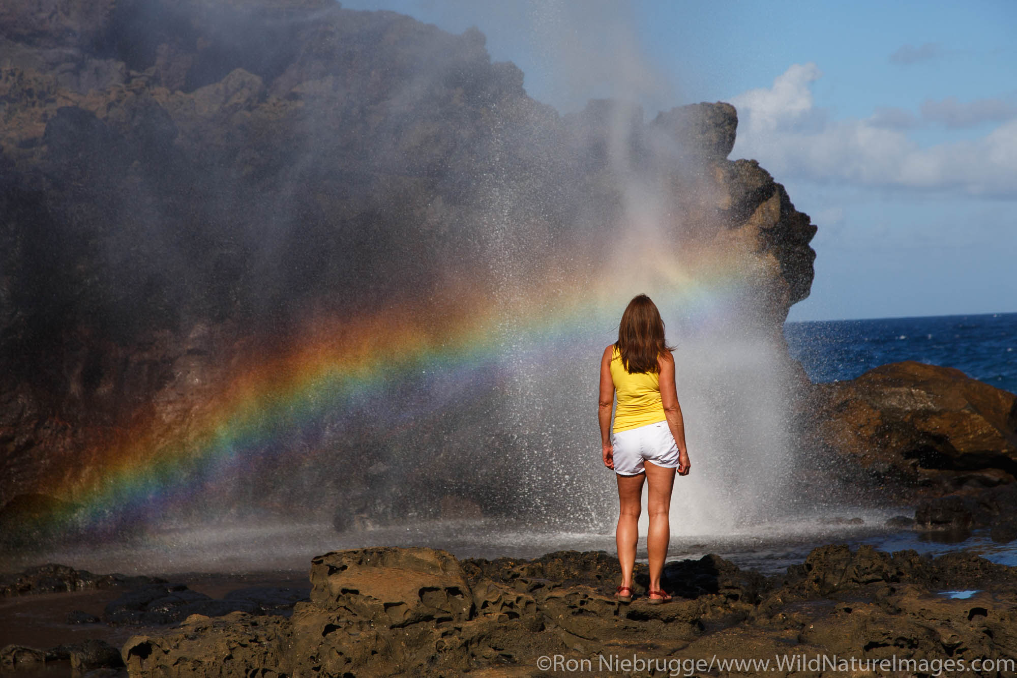 Visitor at the Nakalele Blowhole, Maui, Hawaii.  (model released)