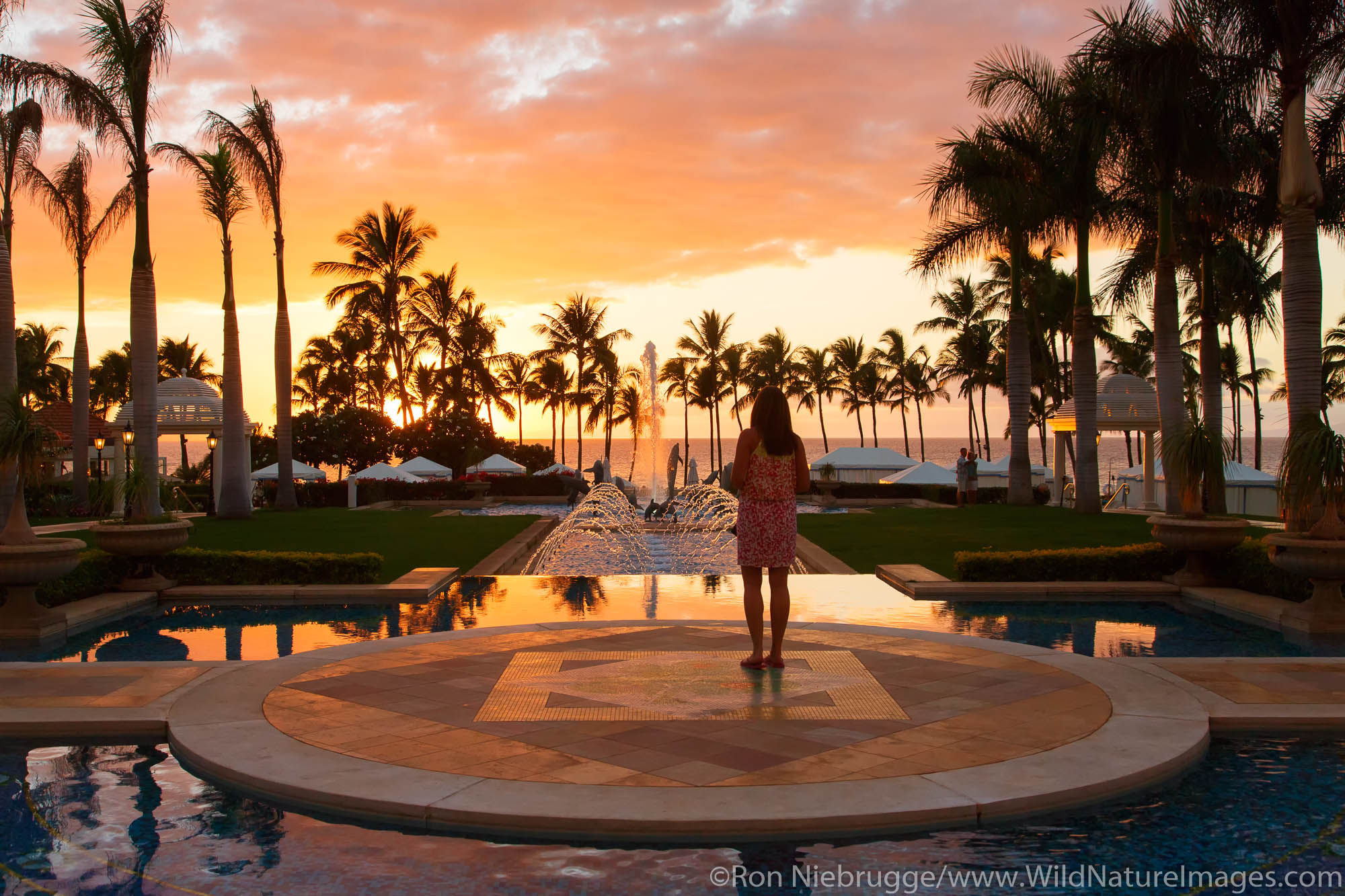 Visitor enjoying sunset, Grand Wailea, Maui, Hawaii.  (model released)