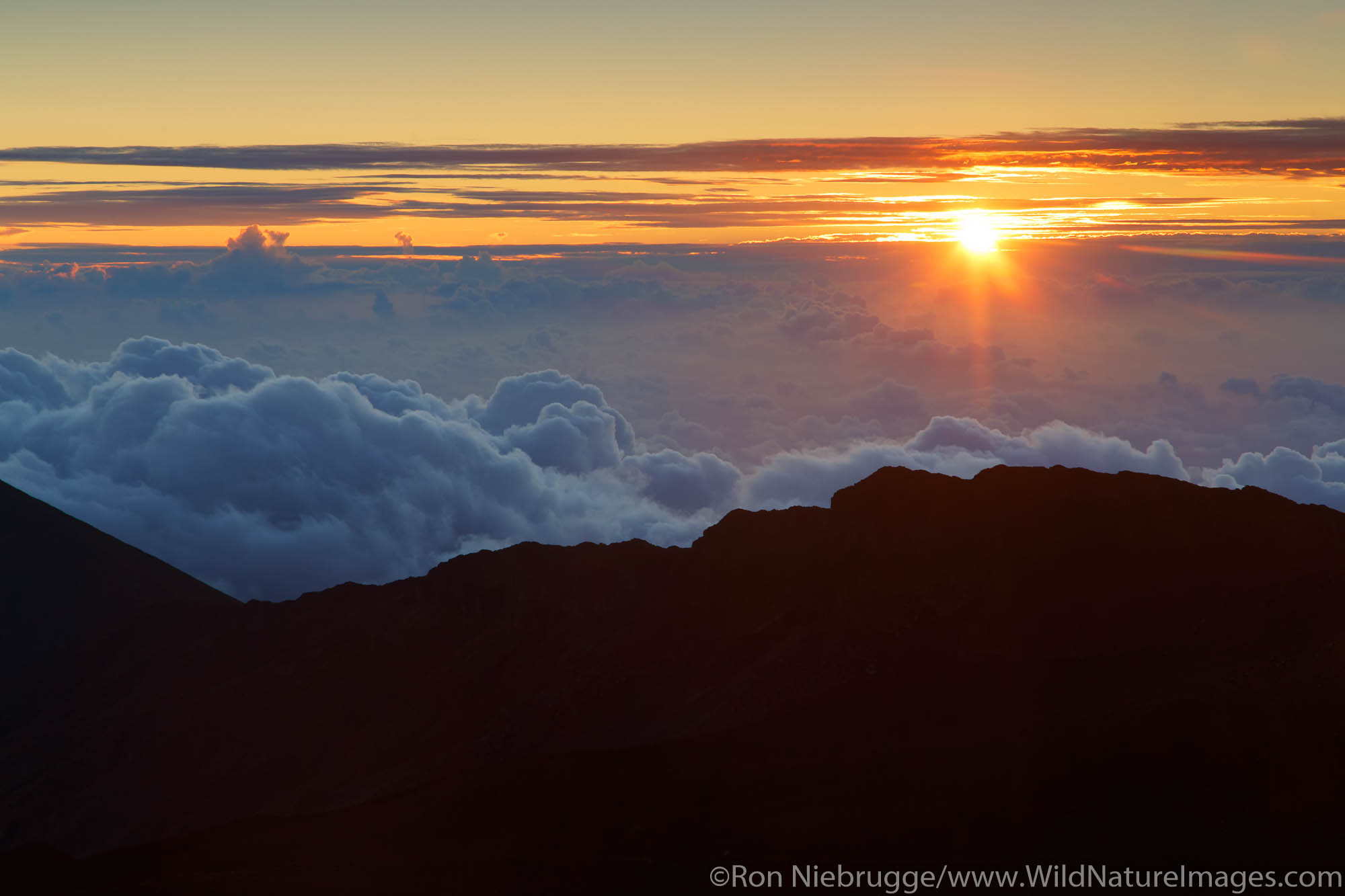 Sunrise from the top of Haleakala, Haleakala National Park, Maui, Hawaii.