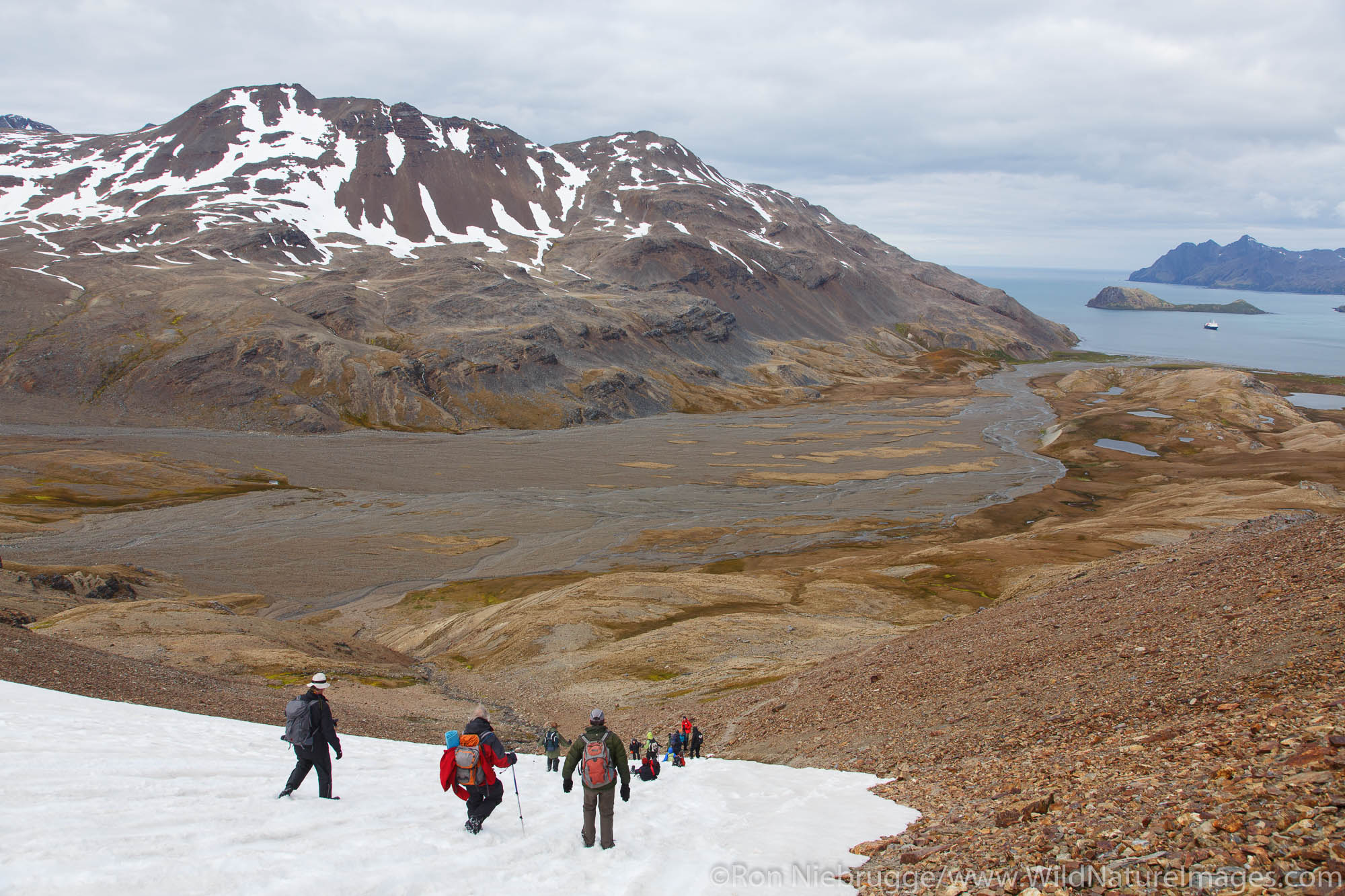 Visitors on the hike between Fortuna Bay and Stromness, the last portion of Shackleton's famous hike, South Georgia Island, Antarctica...