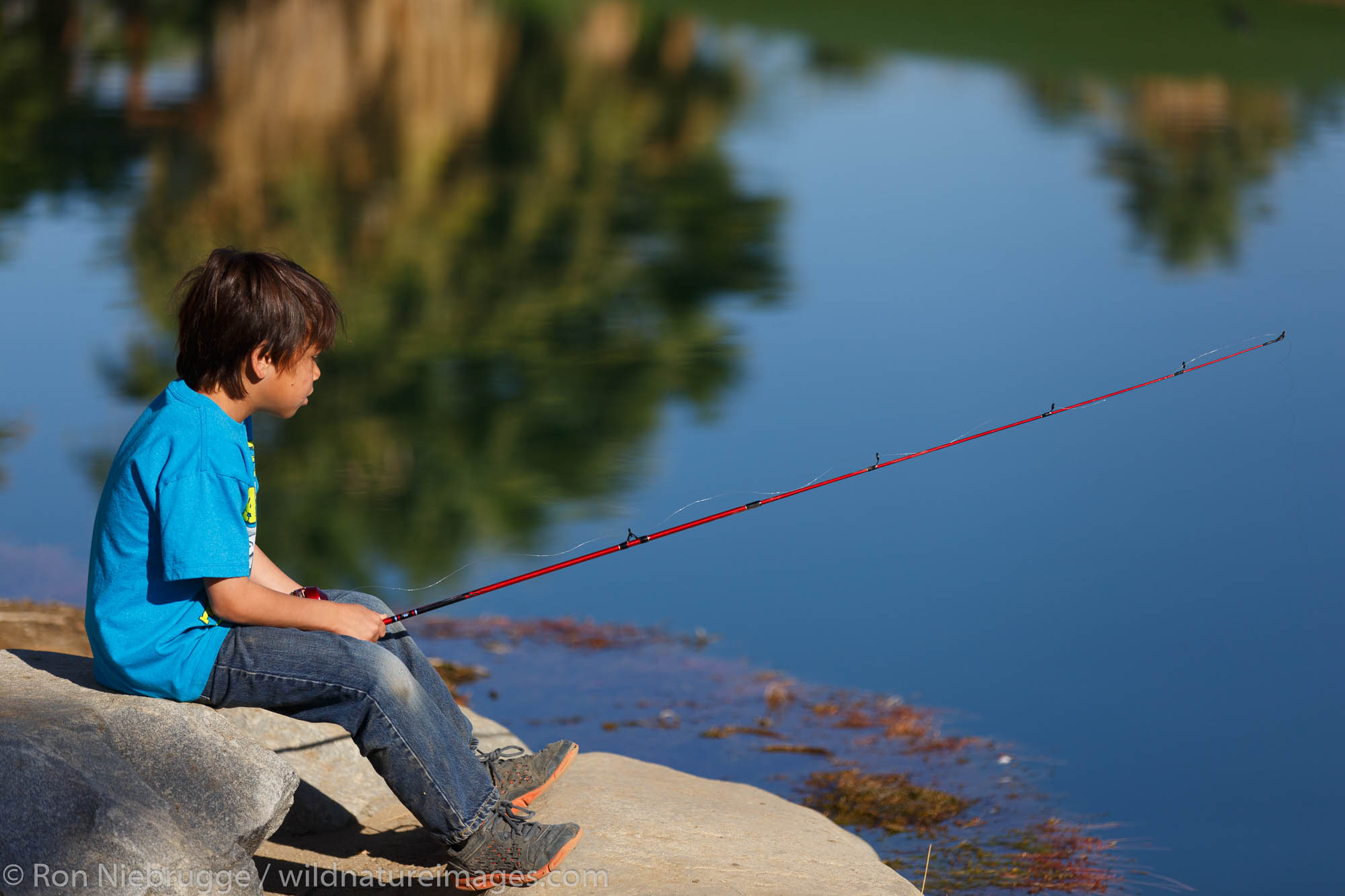 Fishing at the Springs of Borrego, Borrego Springs, California. (model released)