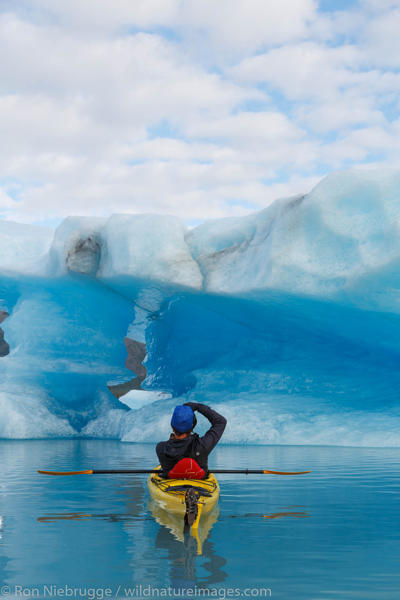 Kayaking in Bear Glacier Lagoon, Kenai Fjords National Park, near Seward, Alaska.  (model released)