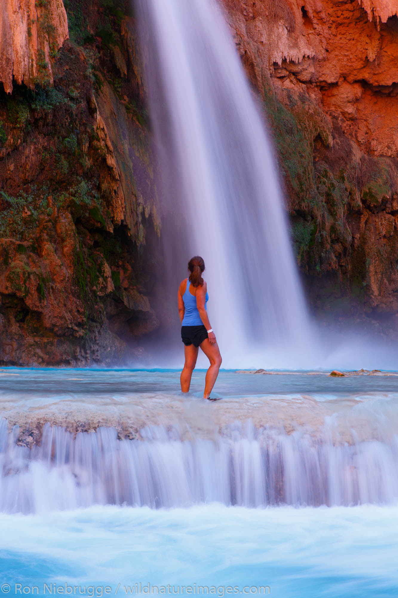 A visitor at Havasu Falls, Havasupai Indian Reservation, Grand Canyon, Arizona.  (model released)