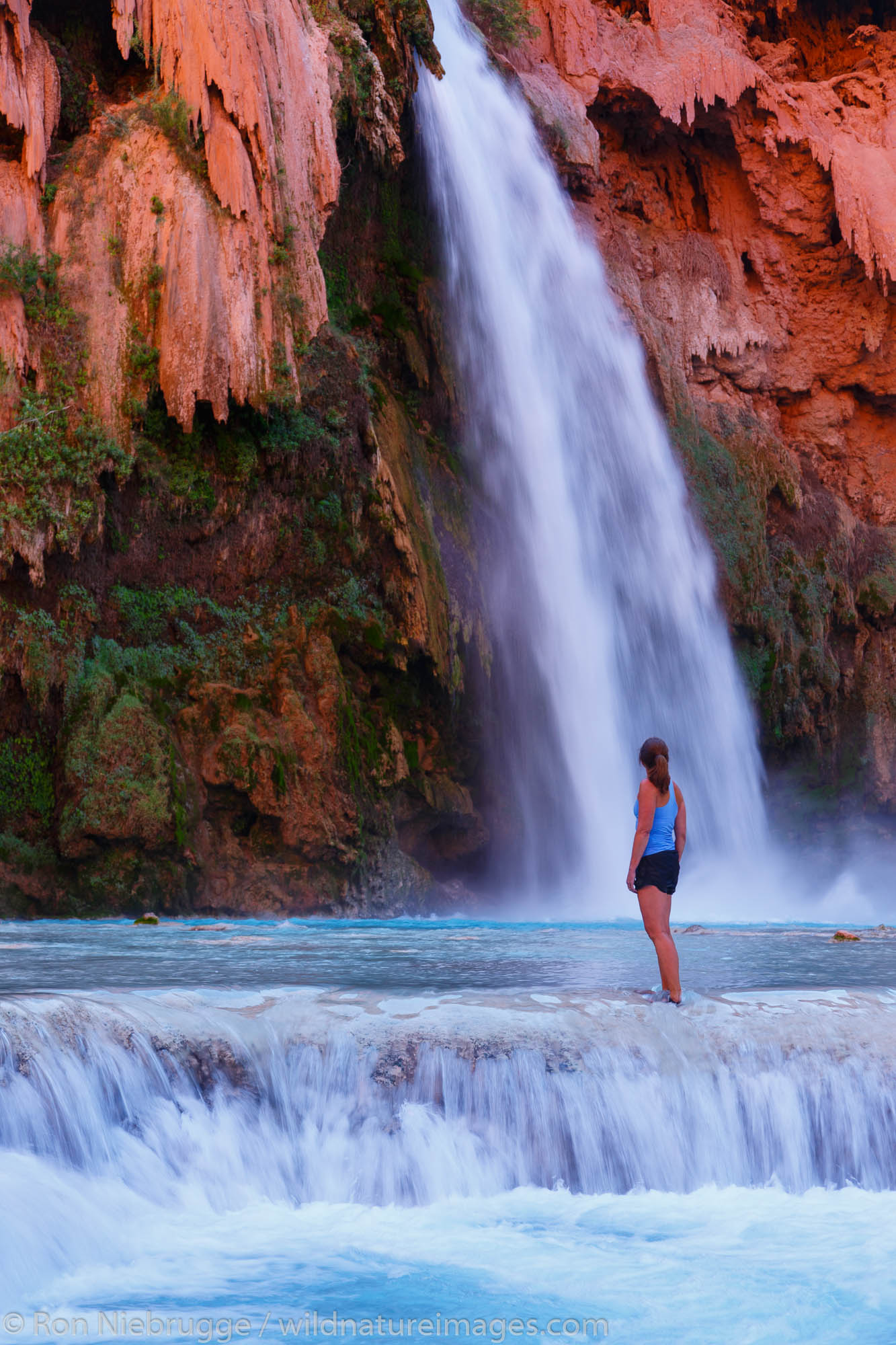 A visitor at Havasu Falls, Havasupai Indian Reservation, Grand Canyon, Arizona.  (model released)