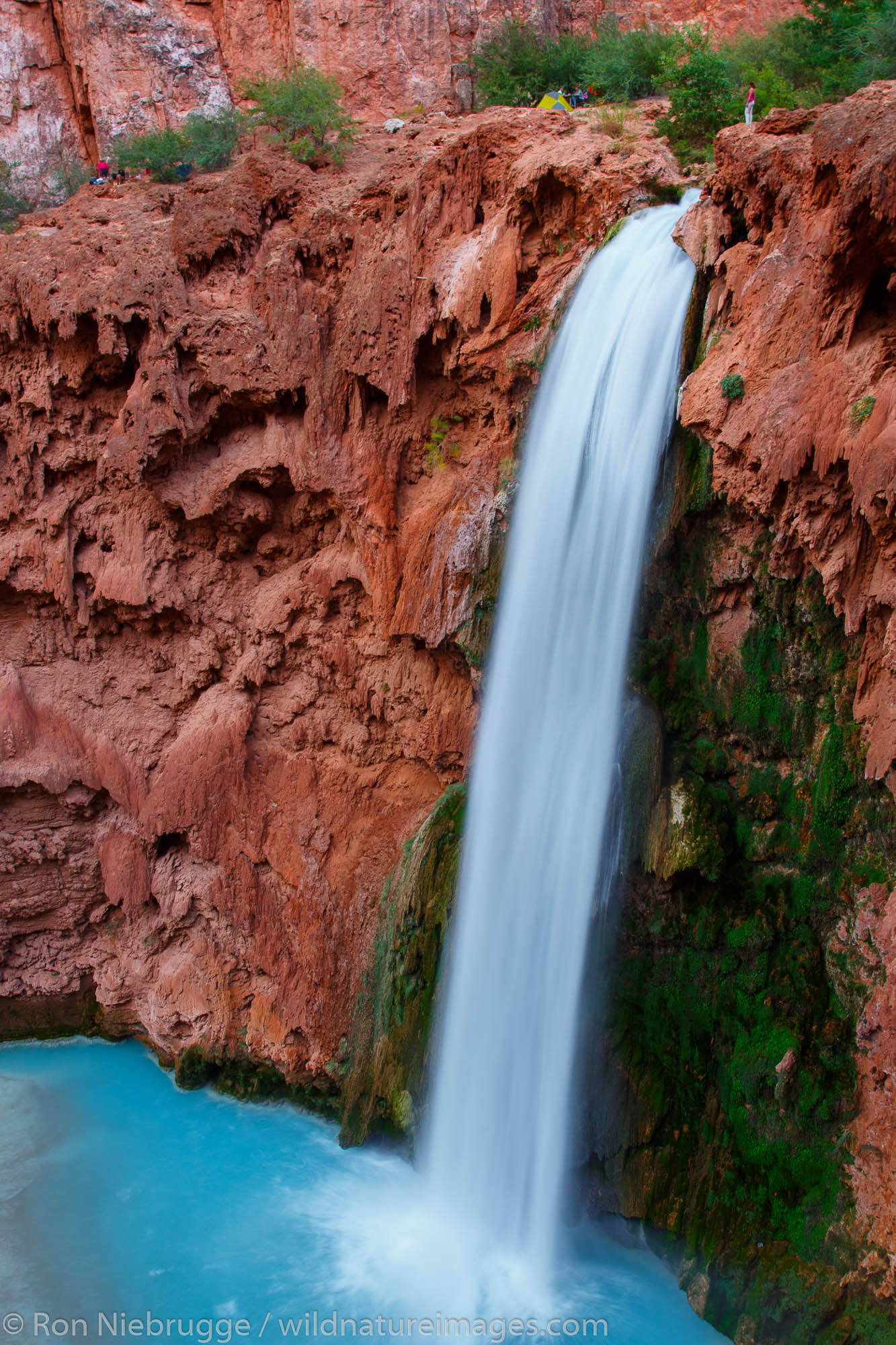 Hiker at Mooney Falls, Havasupai Indian Reservation, Grand Canyon, Arizona.