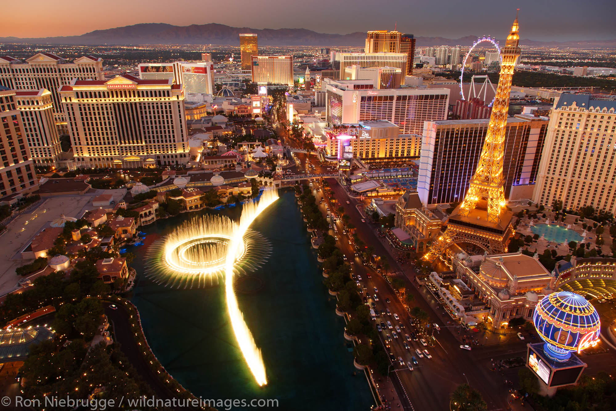 Bellagio Fountain Show and Las Vegas Strip at night, Las Vegas, Nevada.