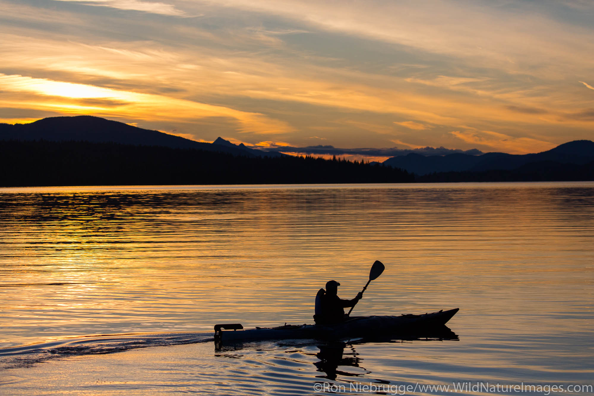 Kayaking at sunset, Tongass National Forest, Alaska.