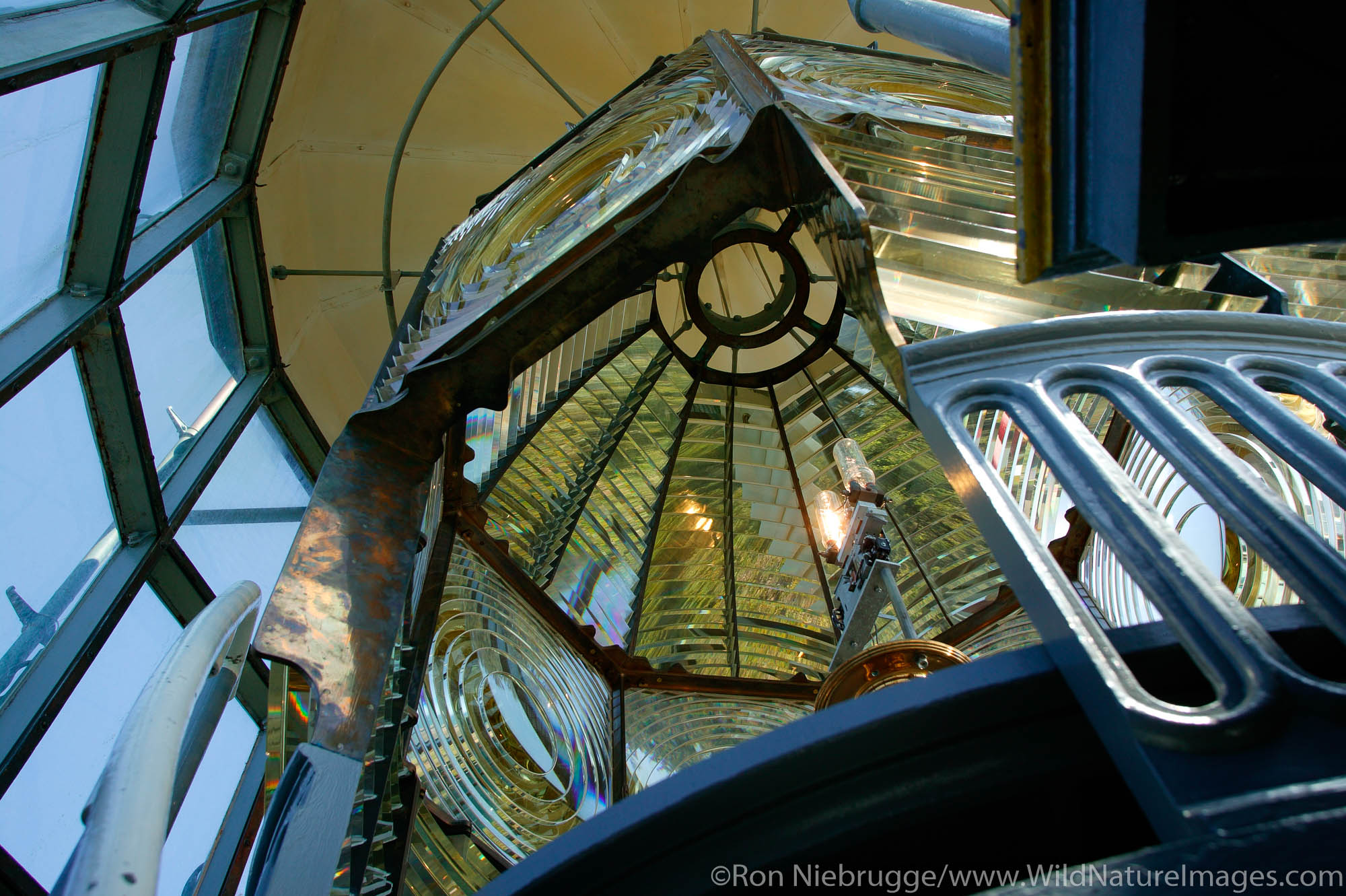 Inside the fresnel lens of the Heceta Head Lighthouse, Oregon.