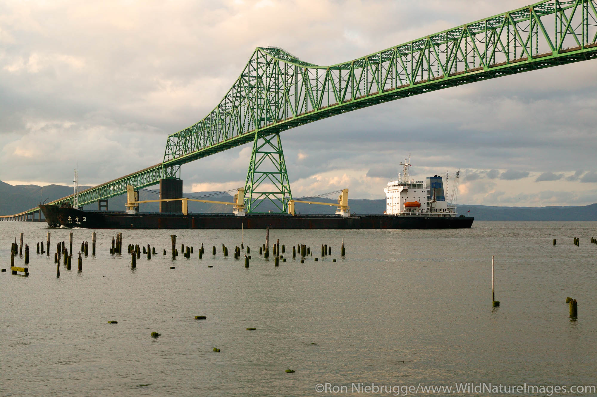 The ship An Ping 3  passes under the Astoria Bridge over the Columbia River, Astoria, Washington