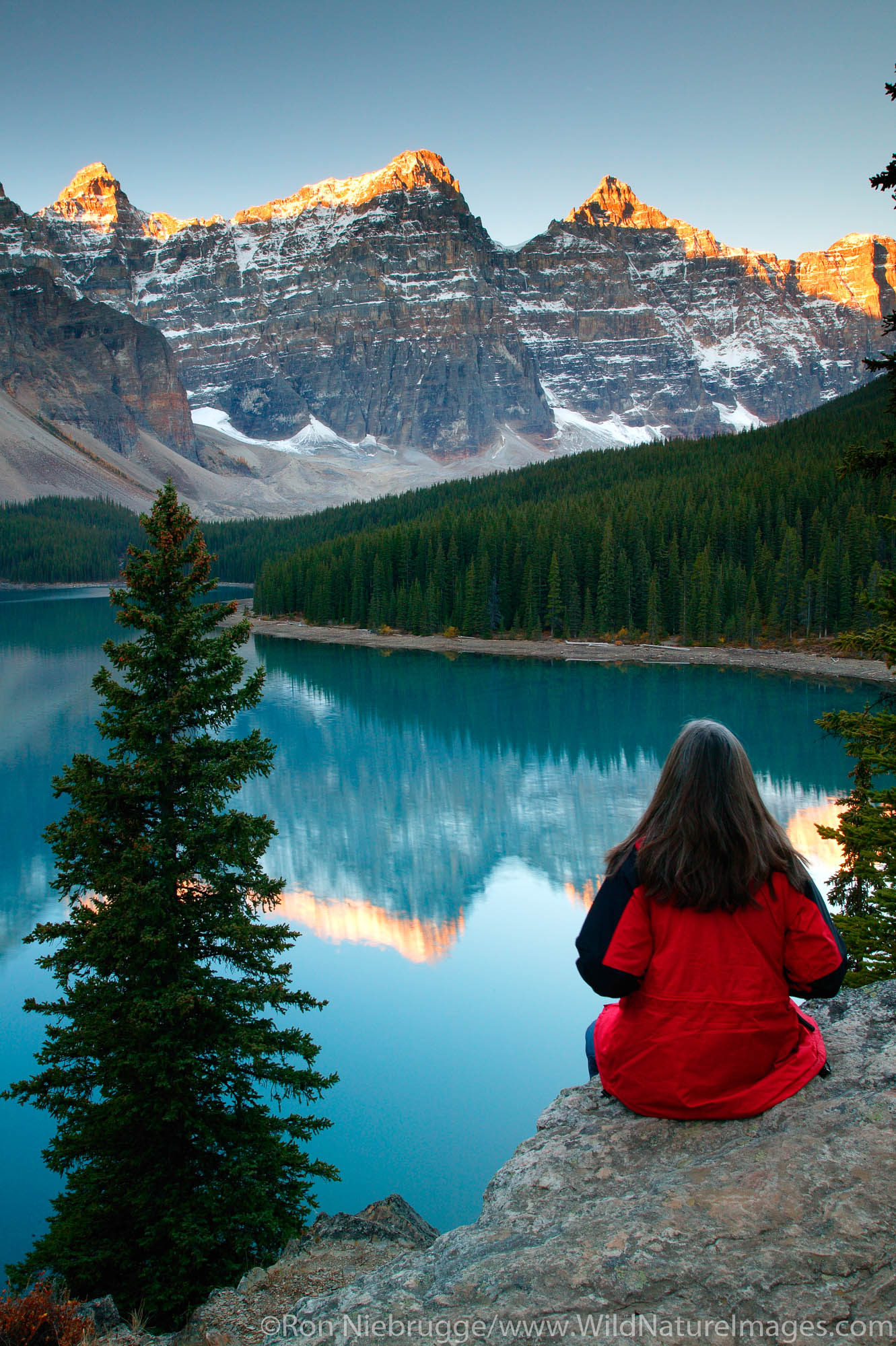 Visitor (MR) views Moraine Lake and the Valley of the Ten Peaks, Banff National Park, Alberta, Canada.  Model Released.
