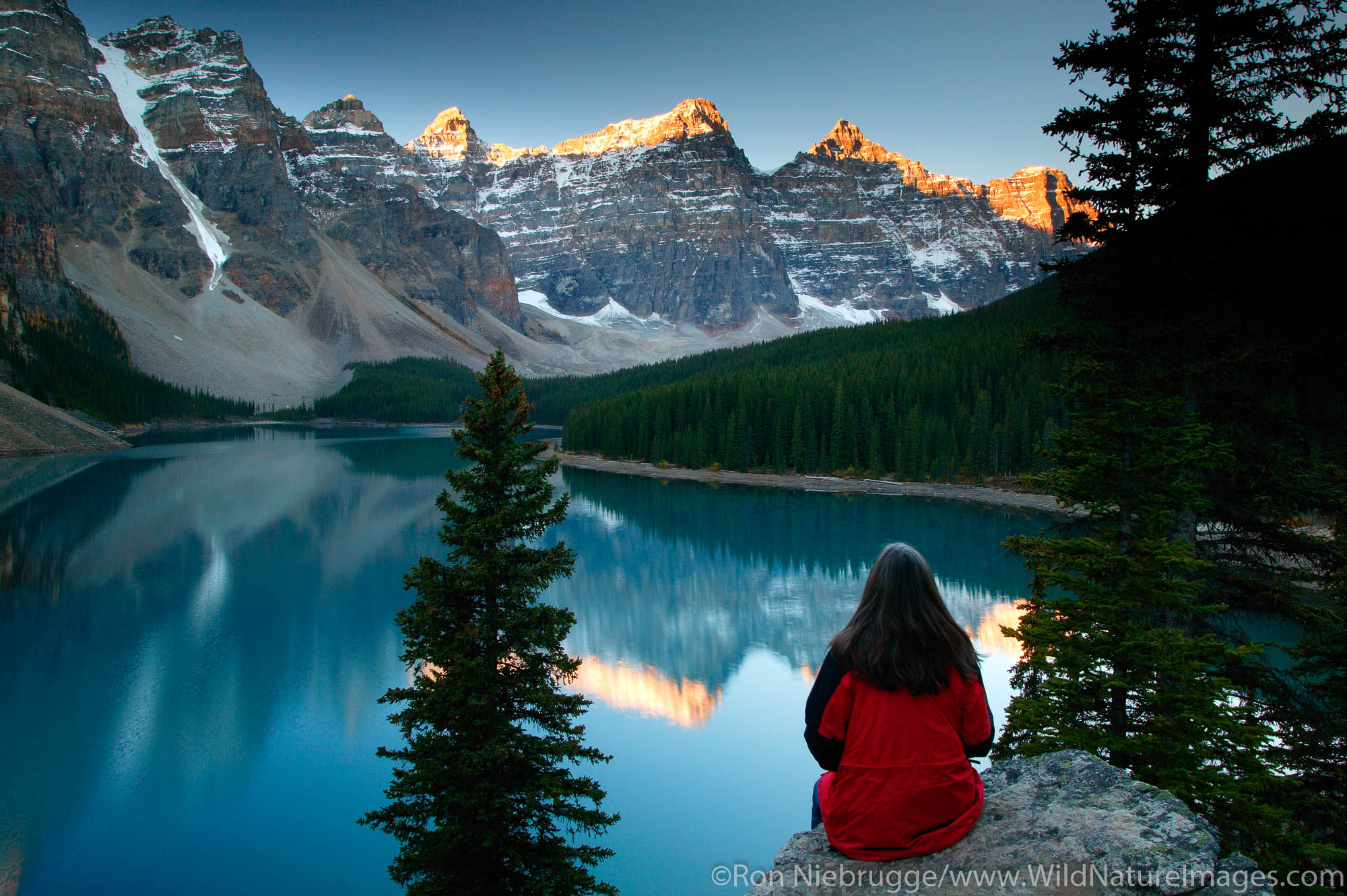 Visitor (MR) views Moraine Lake and the Valley of the Ten Peaks, Banff National Park, Alberta, Canada.  Model Released.